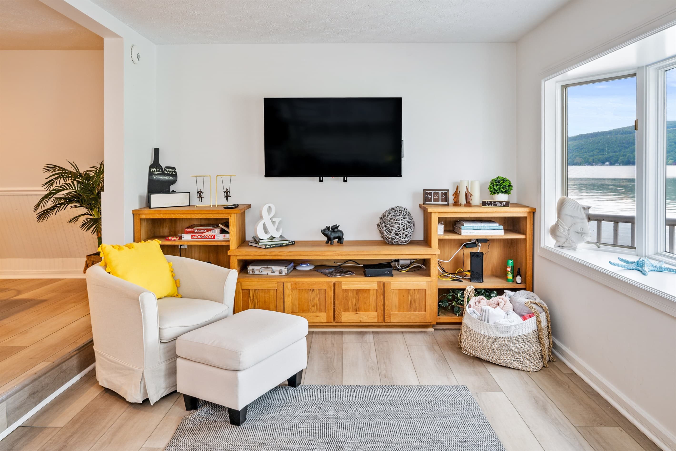 Television above wooden shelving
