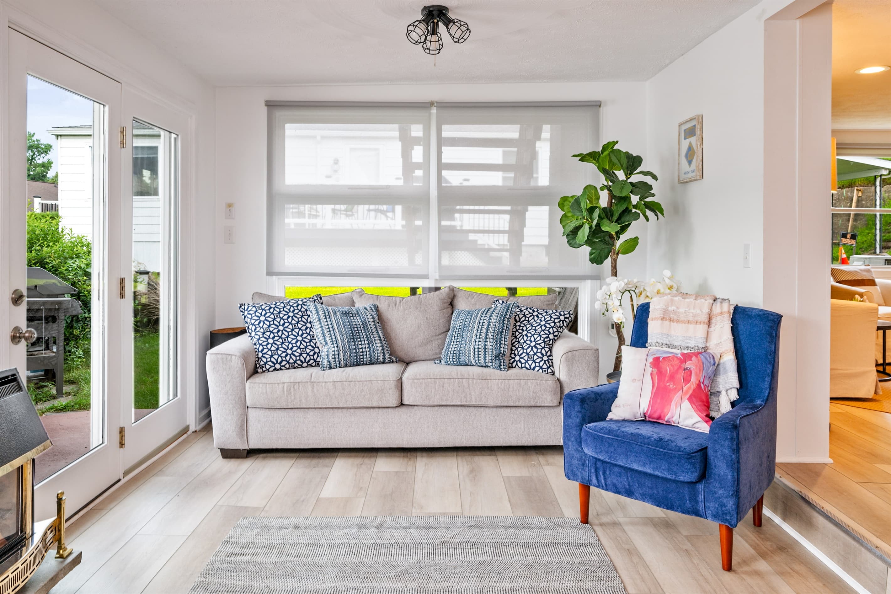 Windowed seating area with blue chair