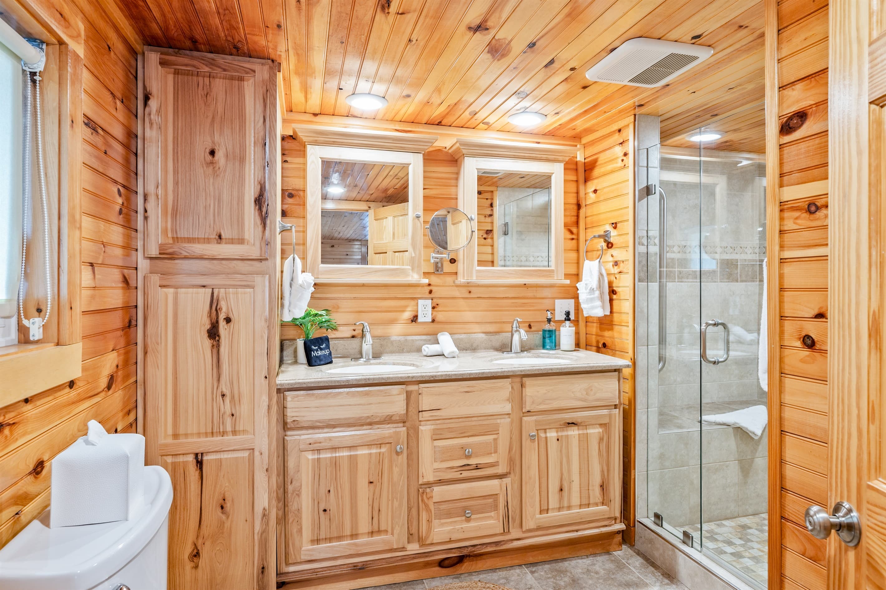 Bathroom vanity beside glass shower