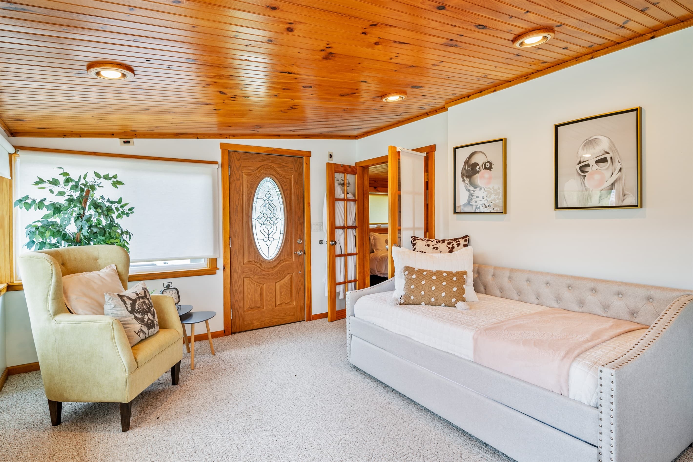 Bed beneath framed wall art