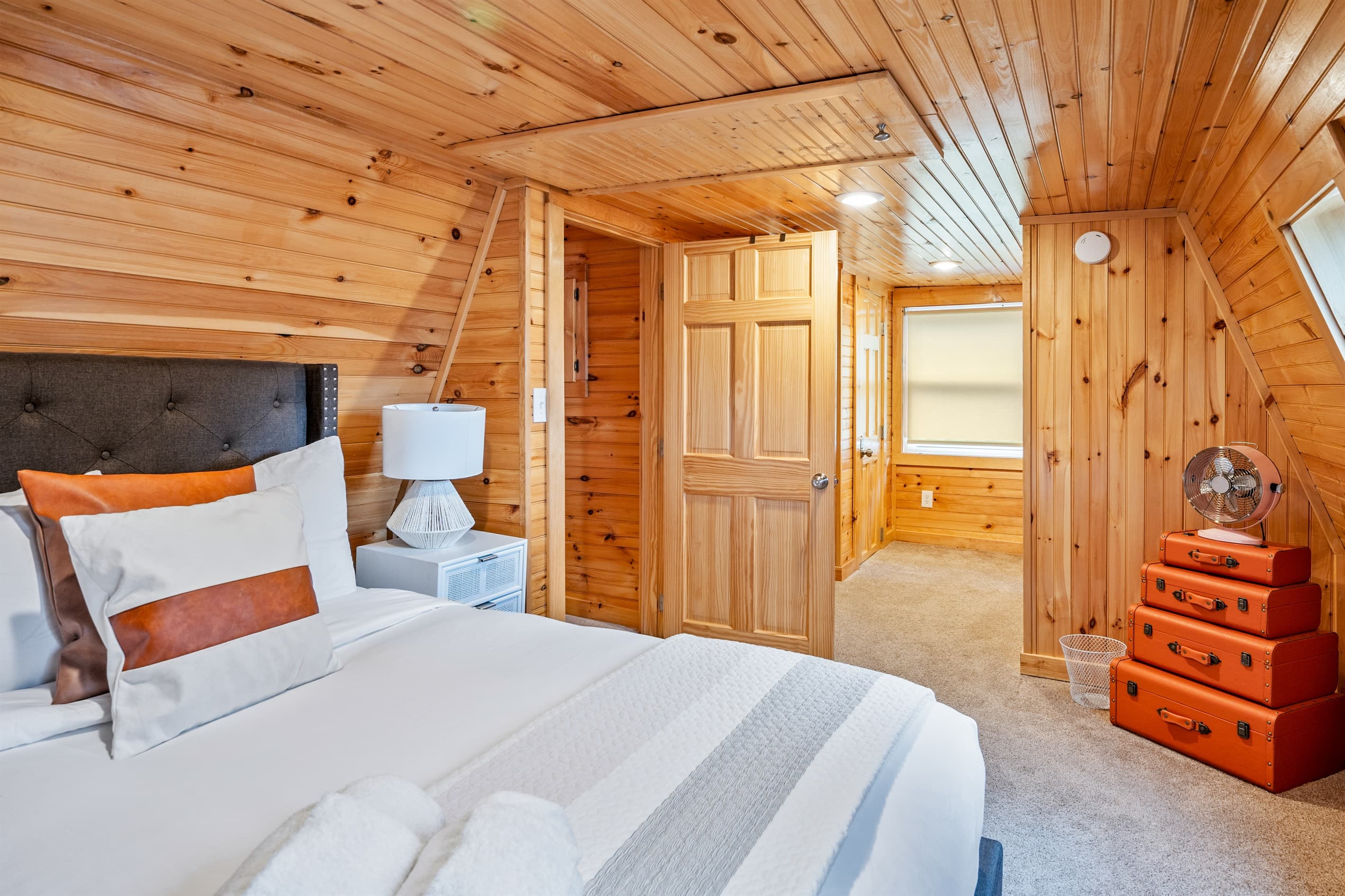 Bedroom with stacked luggage decor