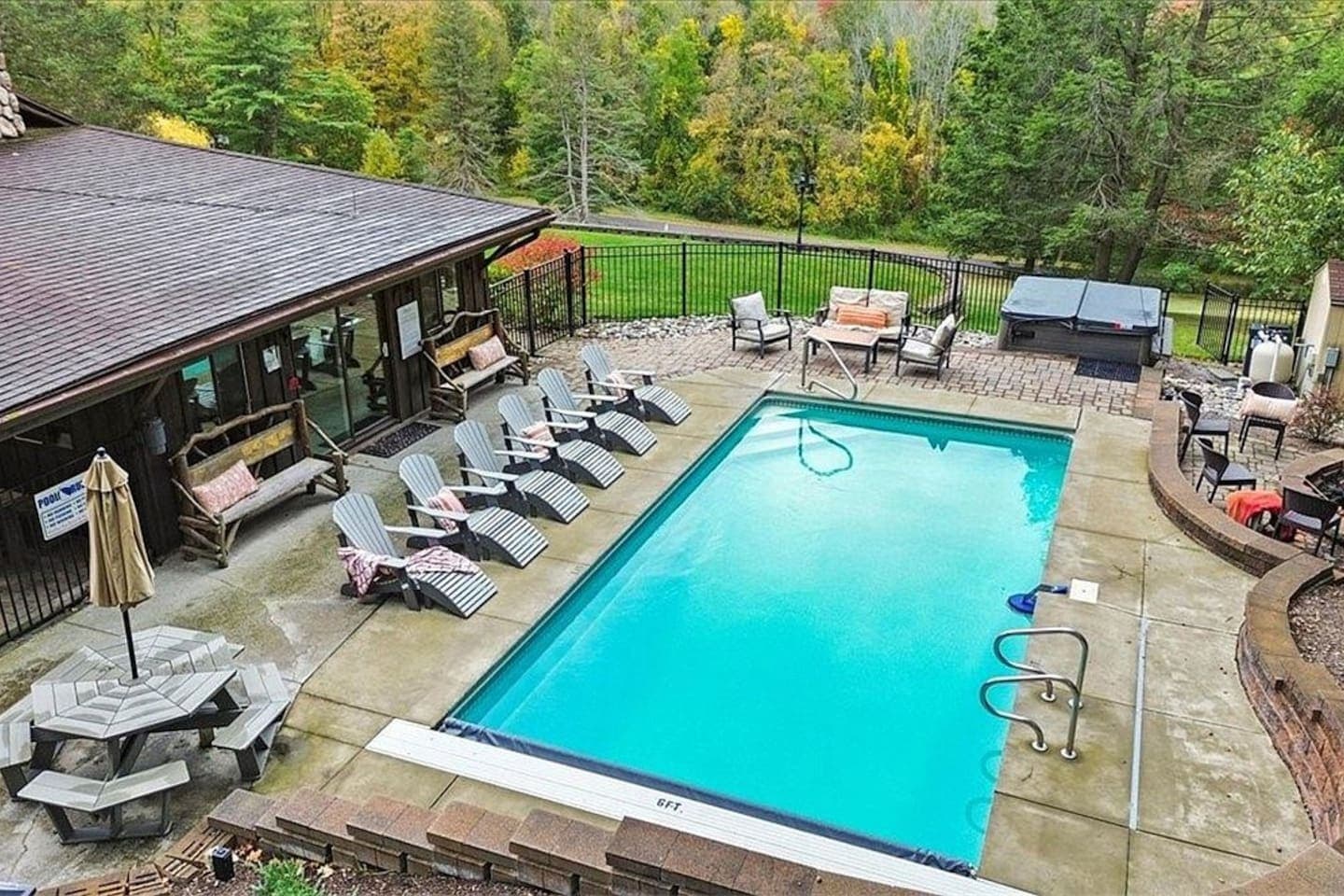 Outdoor pool with surrounding lounge chairs
