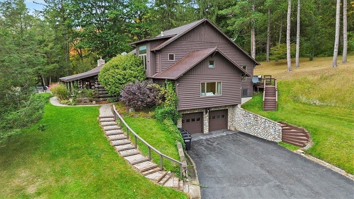 Cabin exterior beside curved stone walkway
