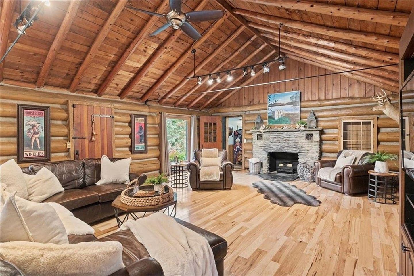 Log-lined living room with vaulted ceiling