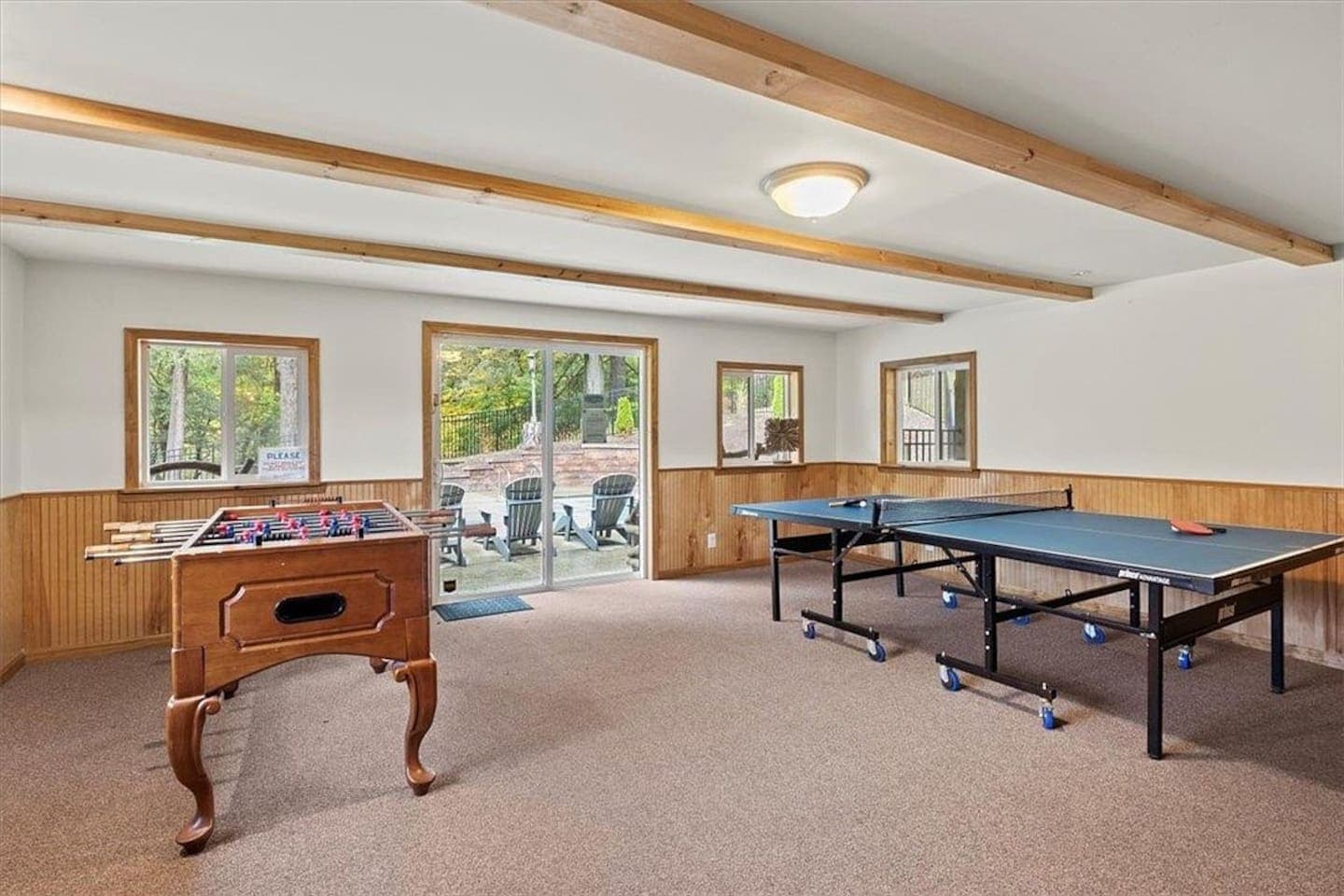 Game room with foosball and ping pong table