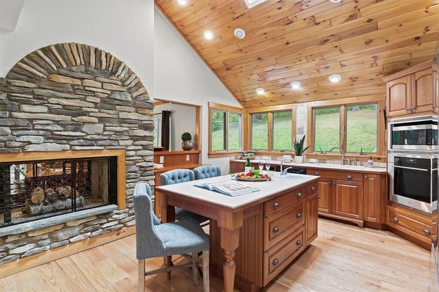Kitchen with stone arch and island