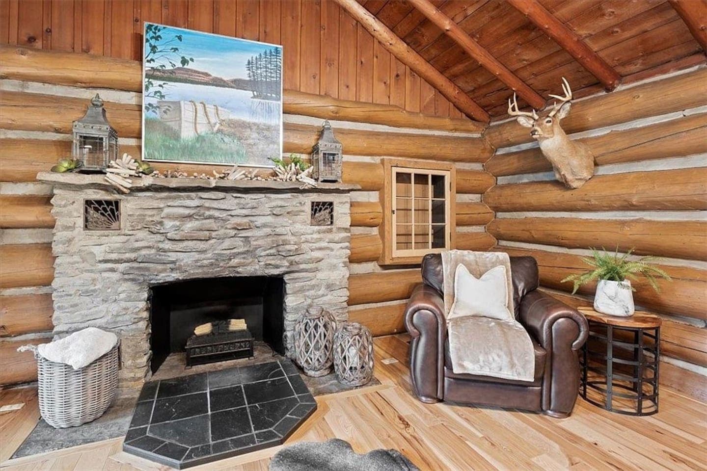 Stone fireplace anchoring the family room
