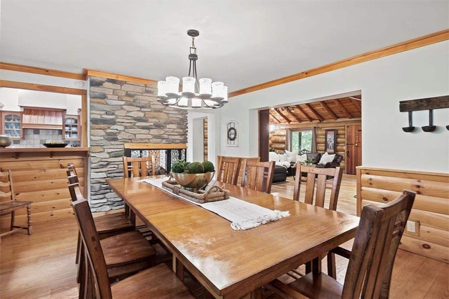 Wooden dining table with a view of the living area