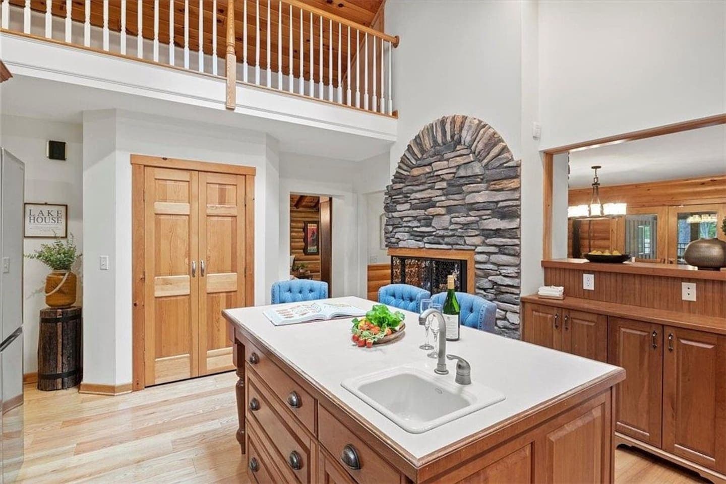Kitchen island with bar and blue stools 