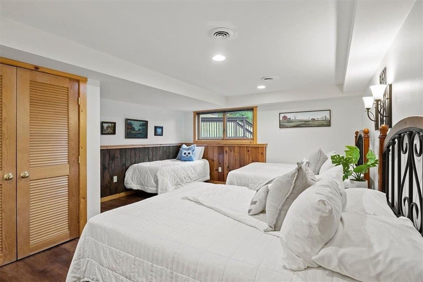 Multiple beds arranged in a spacious room