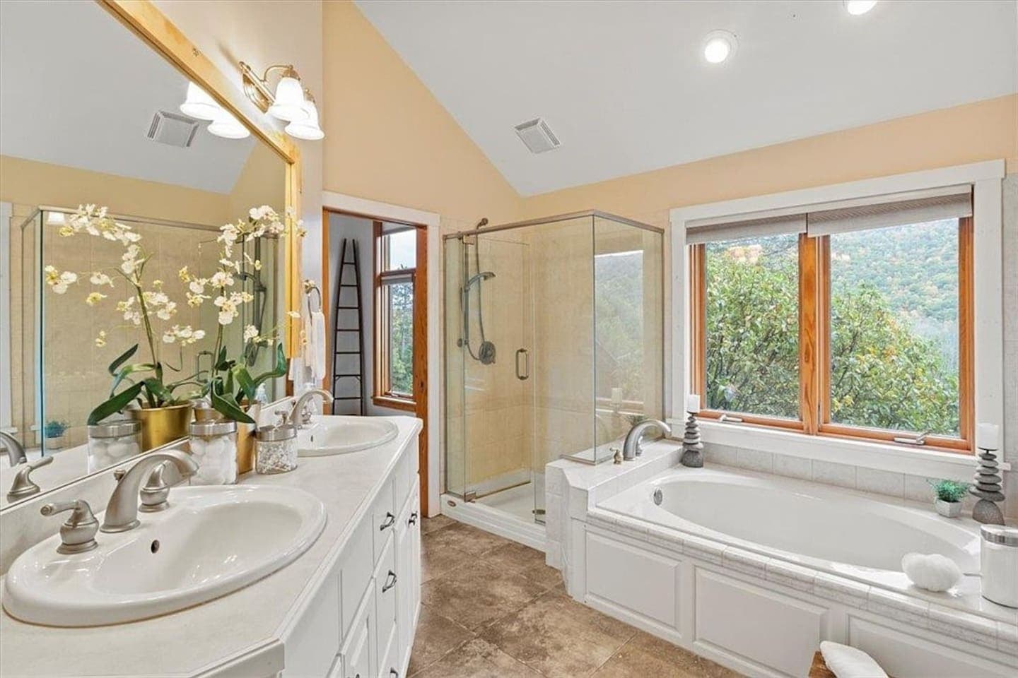 Bathroom with dual sinks and large mirror