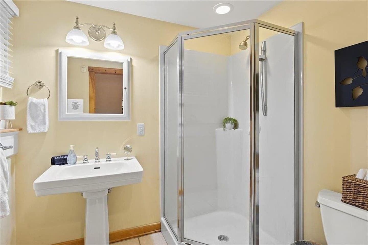 Bathroom vanity with illuminated wall mirror