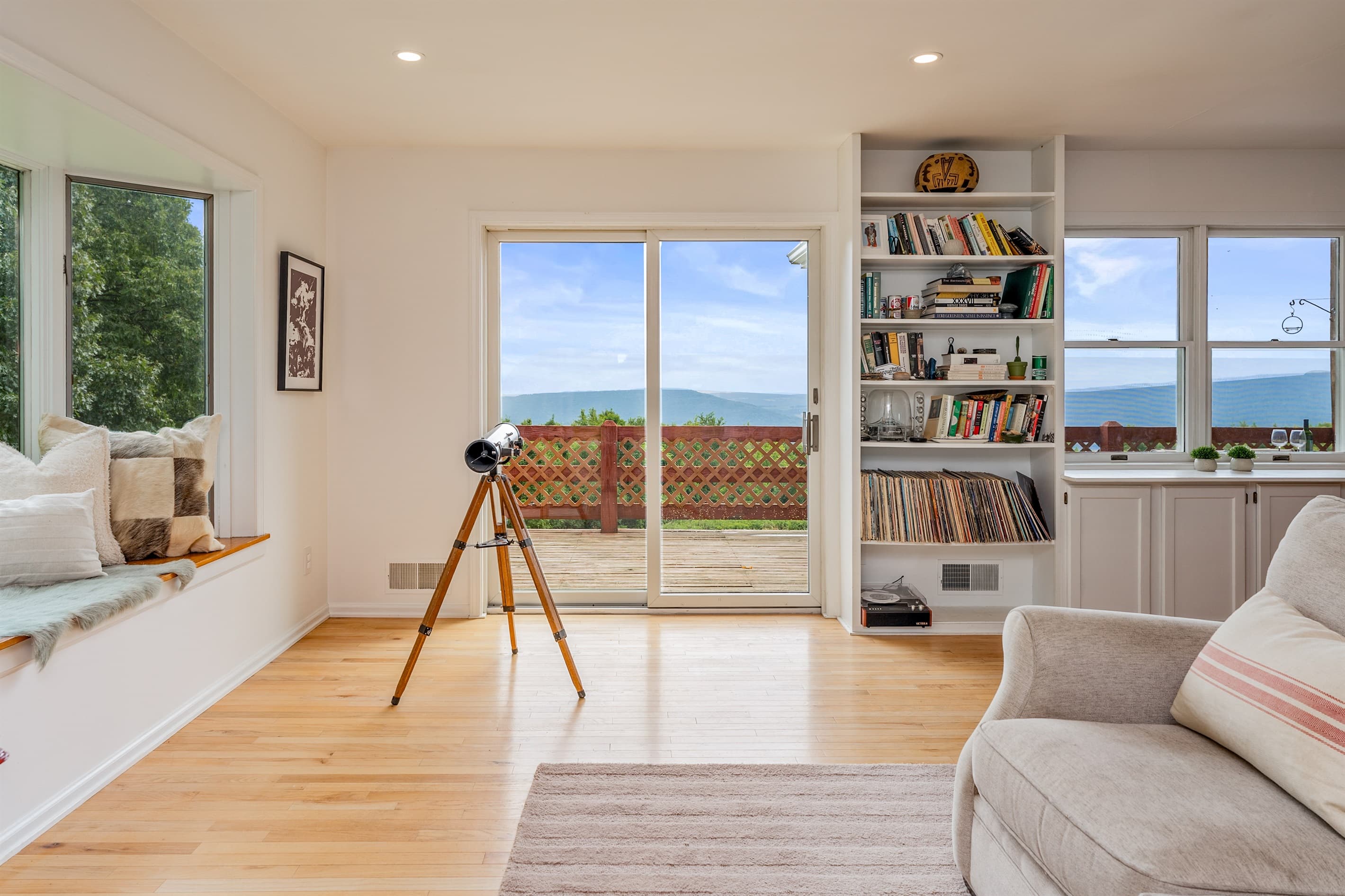Telescope positioned between large windows