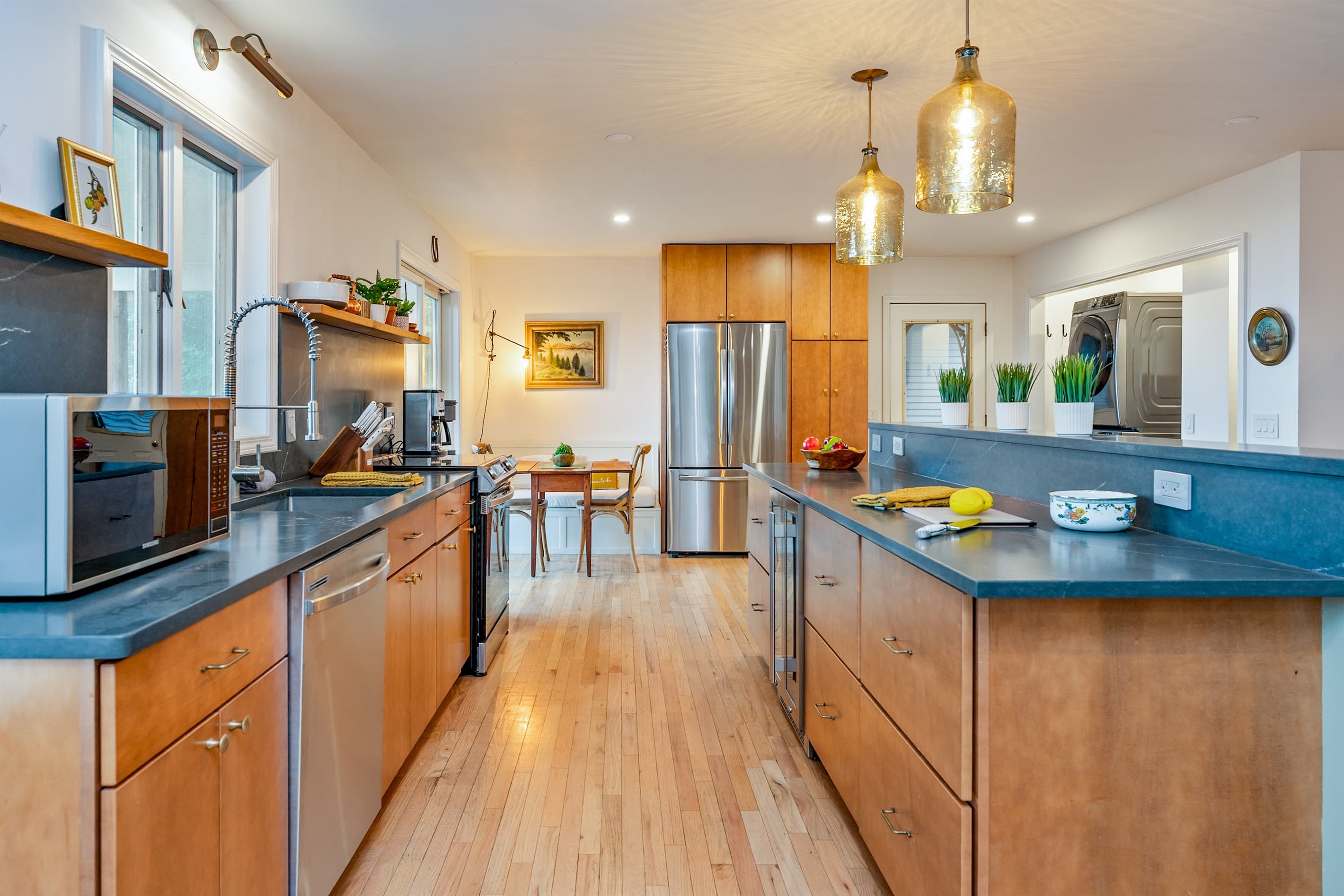 Grey kitchen counter beneath pendant lights