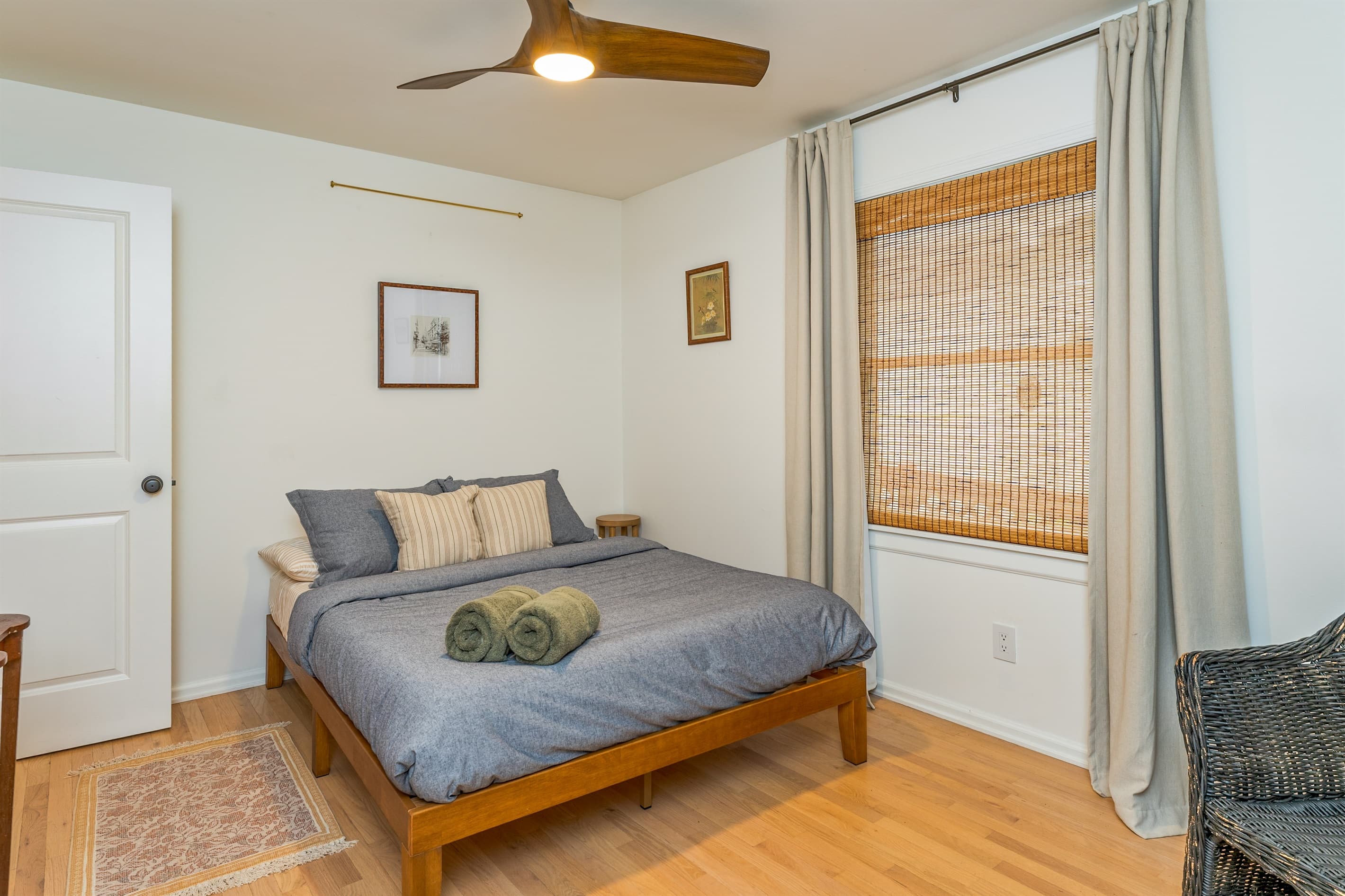 Bed positioned beside large window