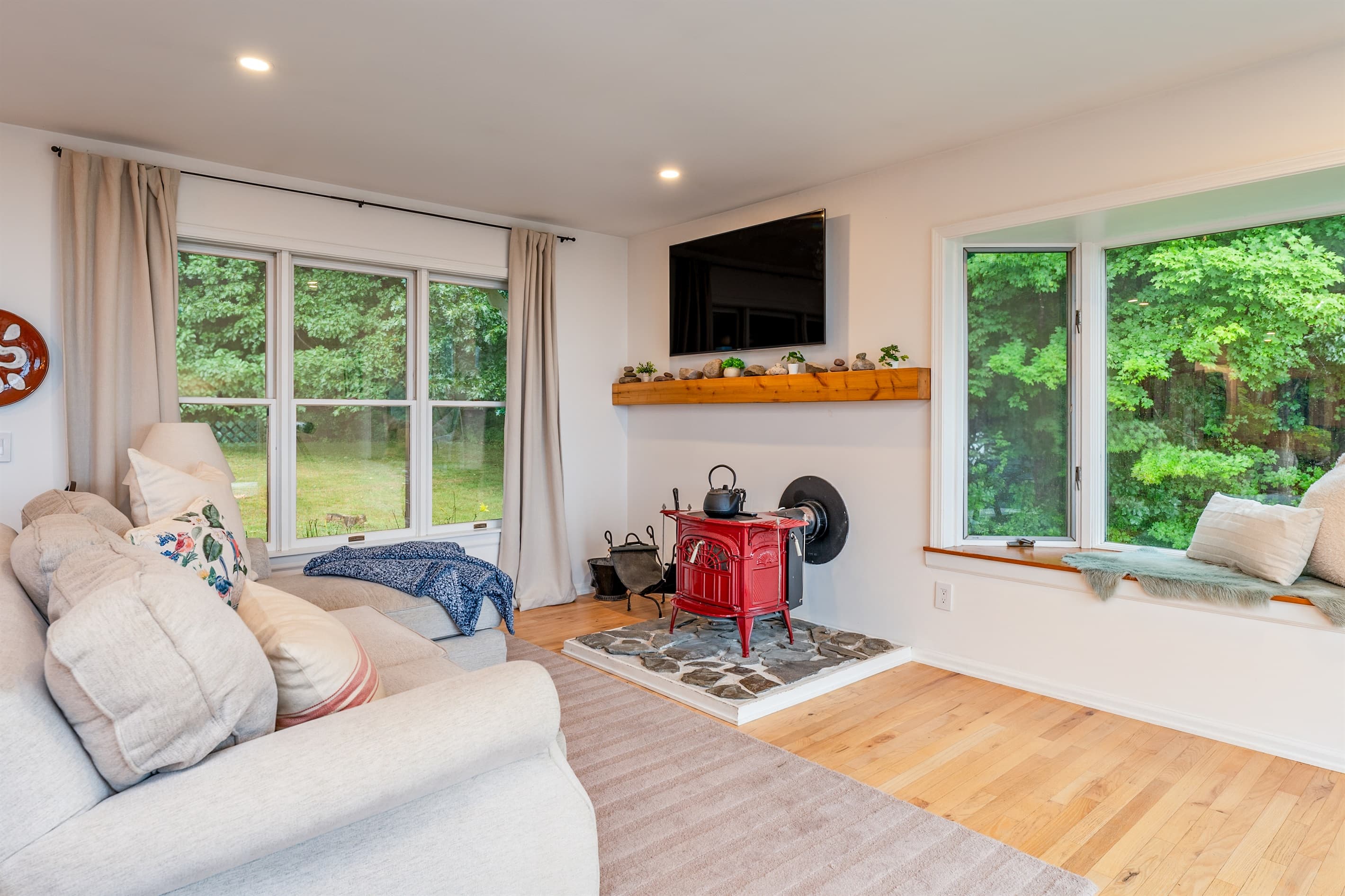 Living room with fireplace and large windows