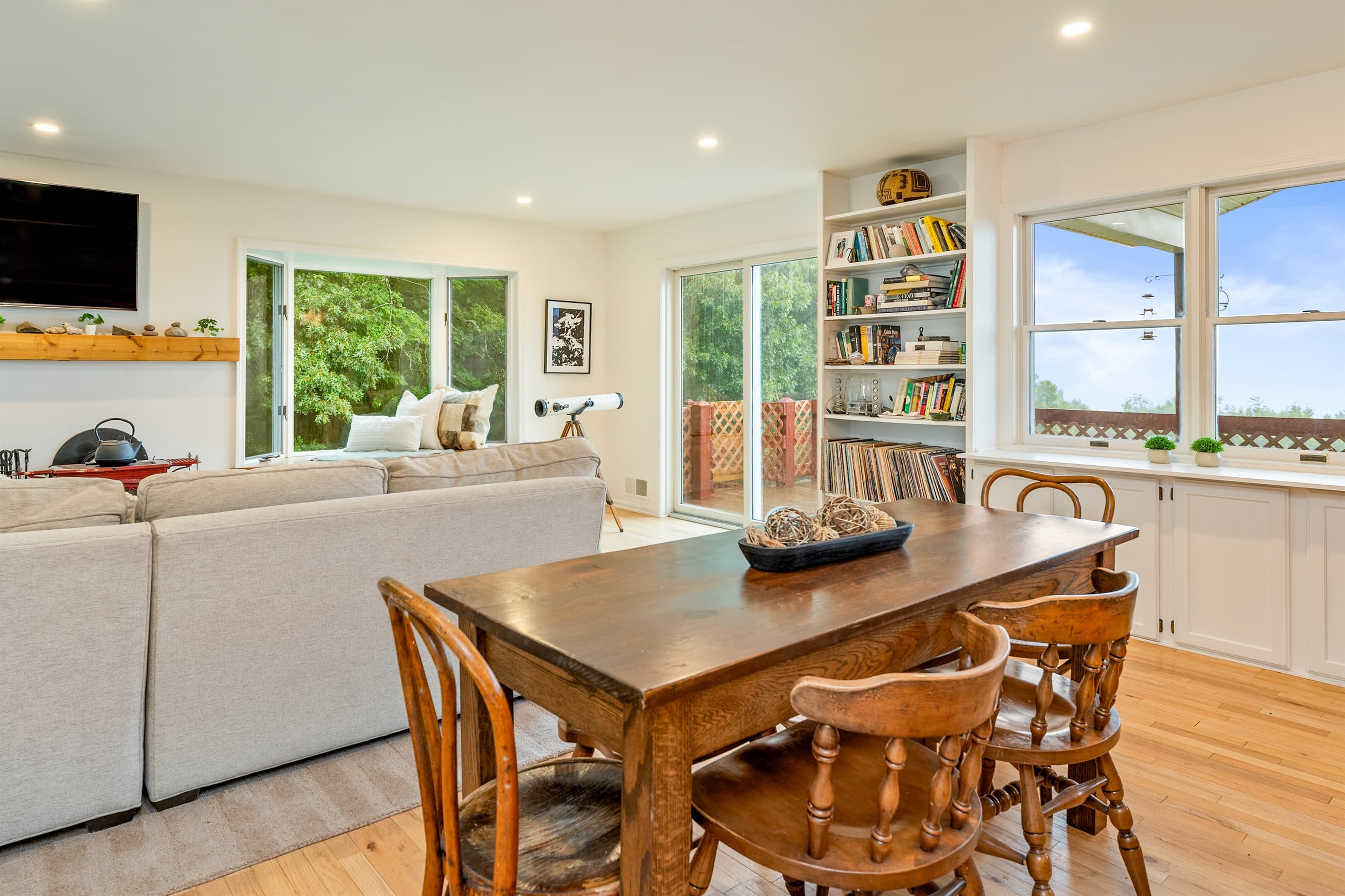 Dining table surrounded by windows