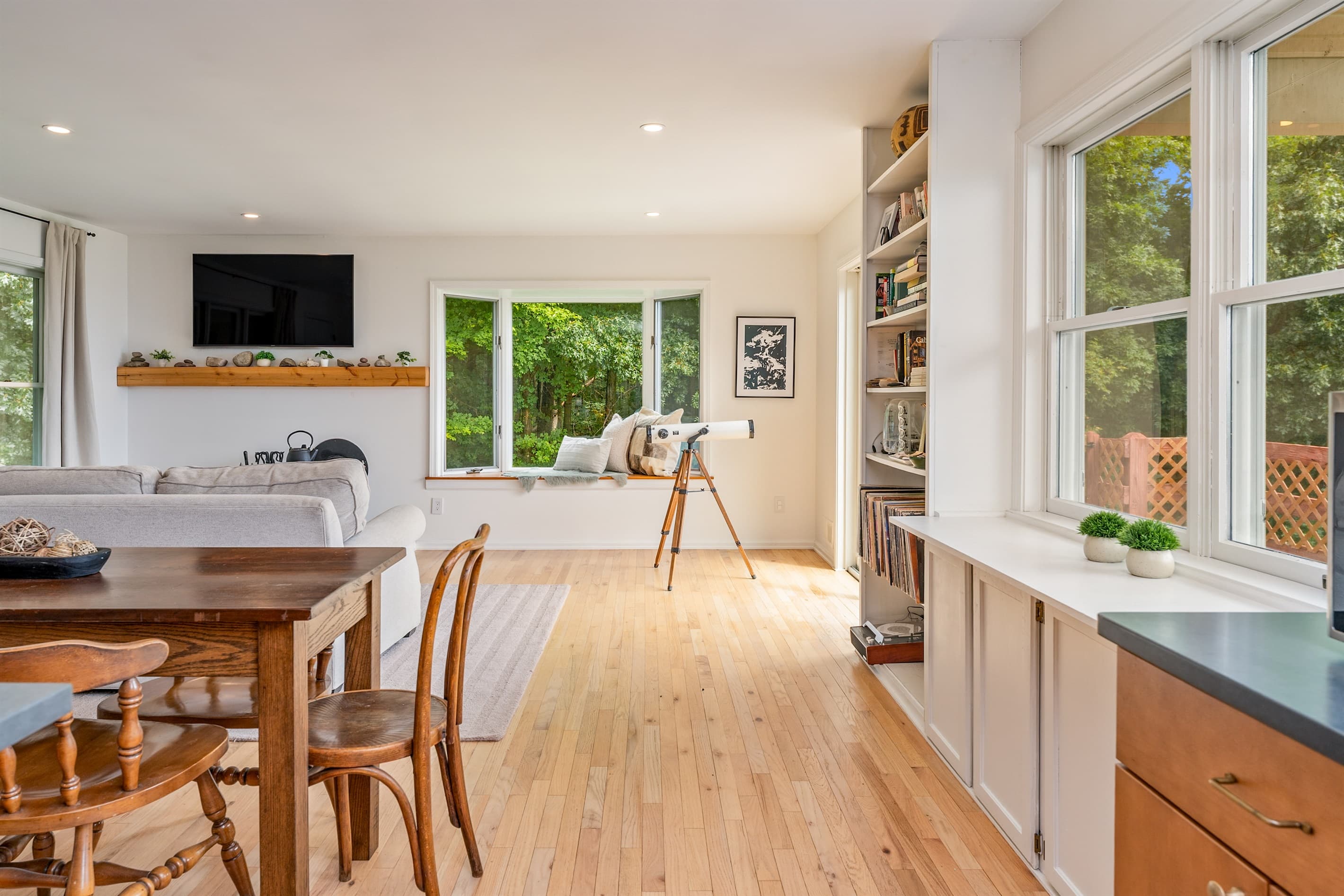 Dining area beside built-in shelving