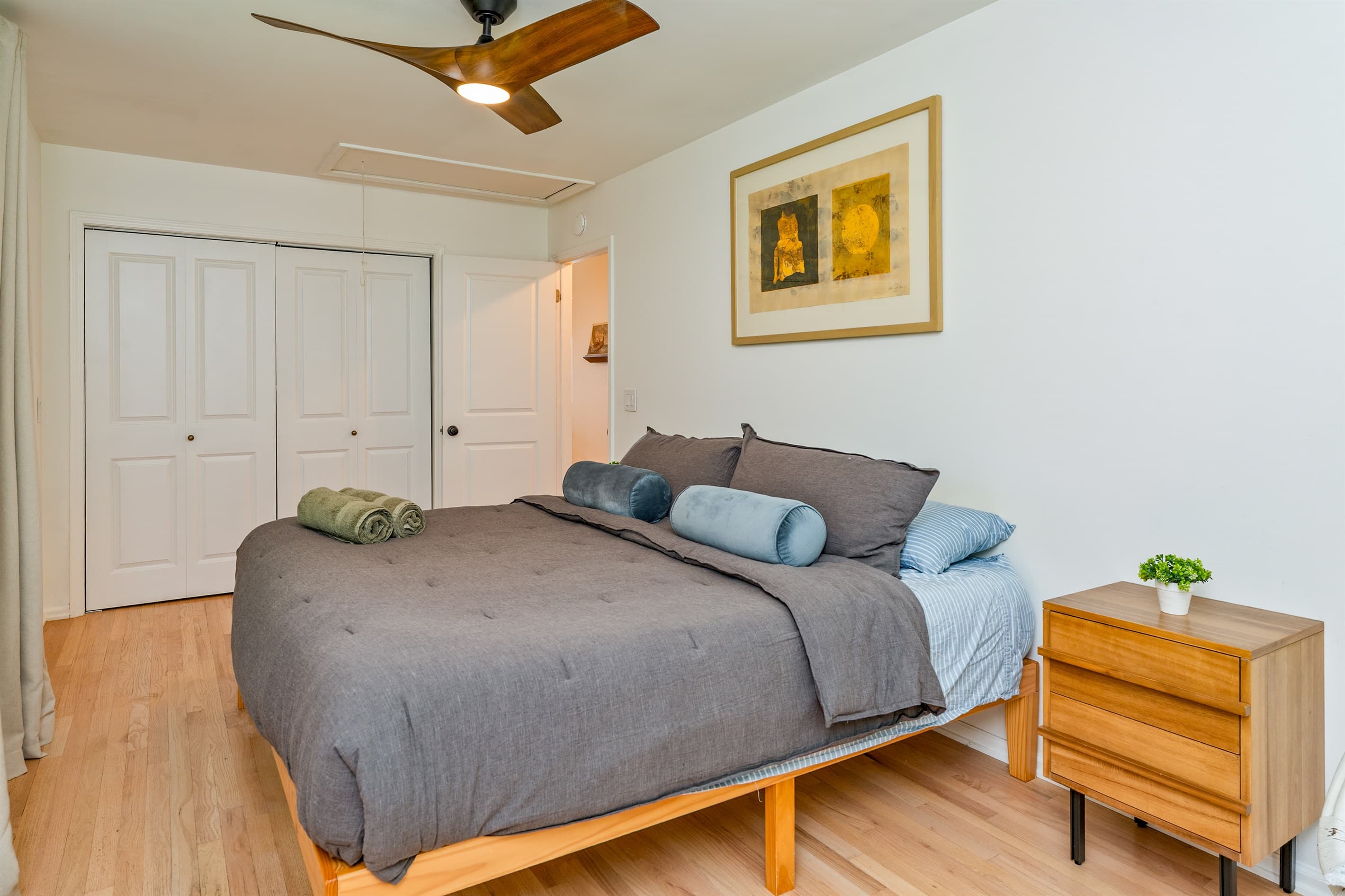 Bed with blue accent pillows