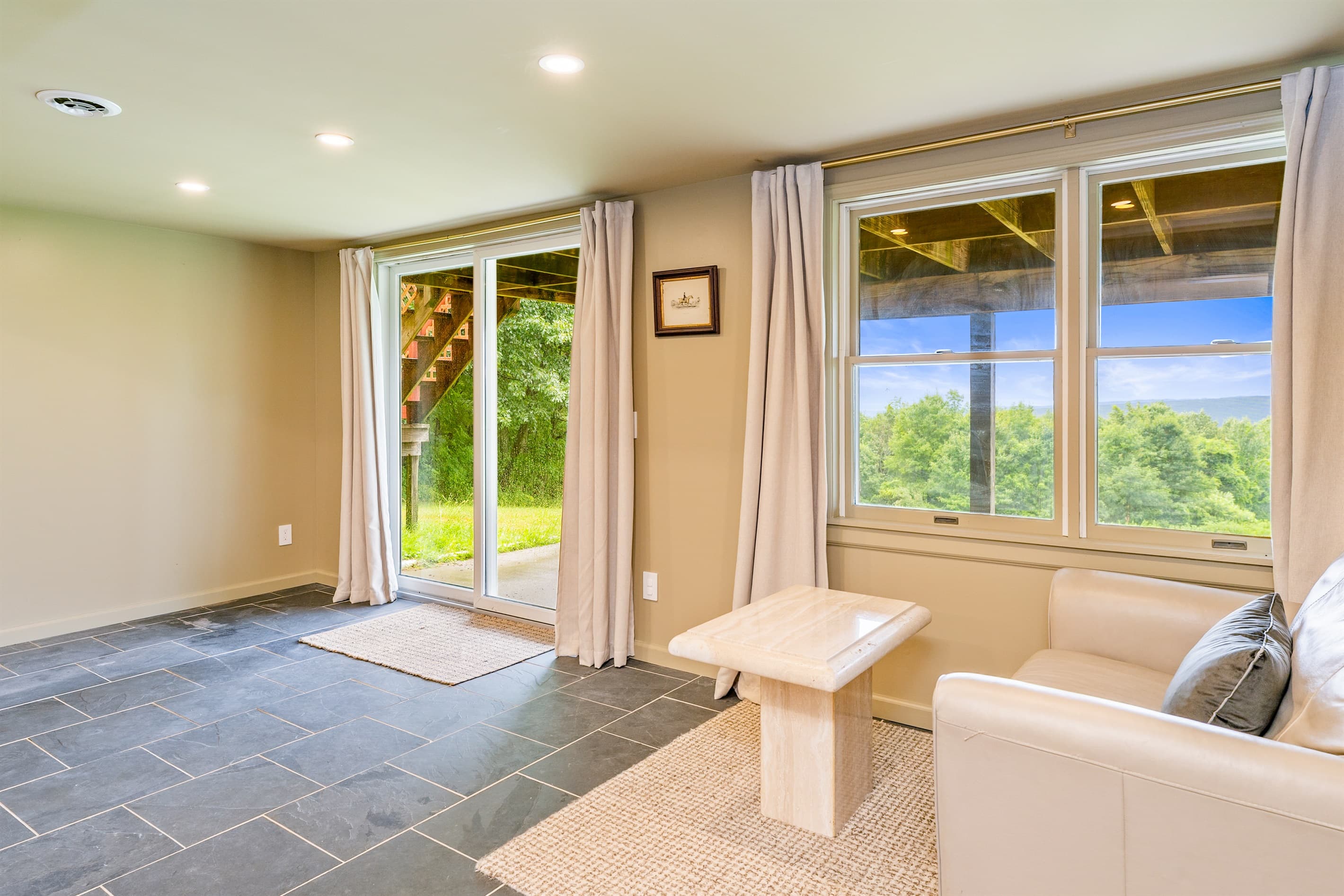 Seating area beside a large window 