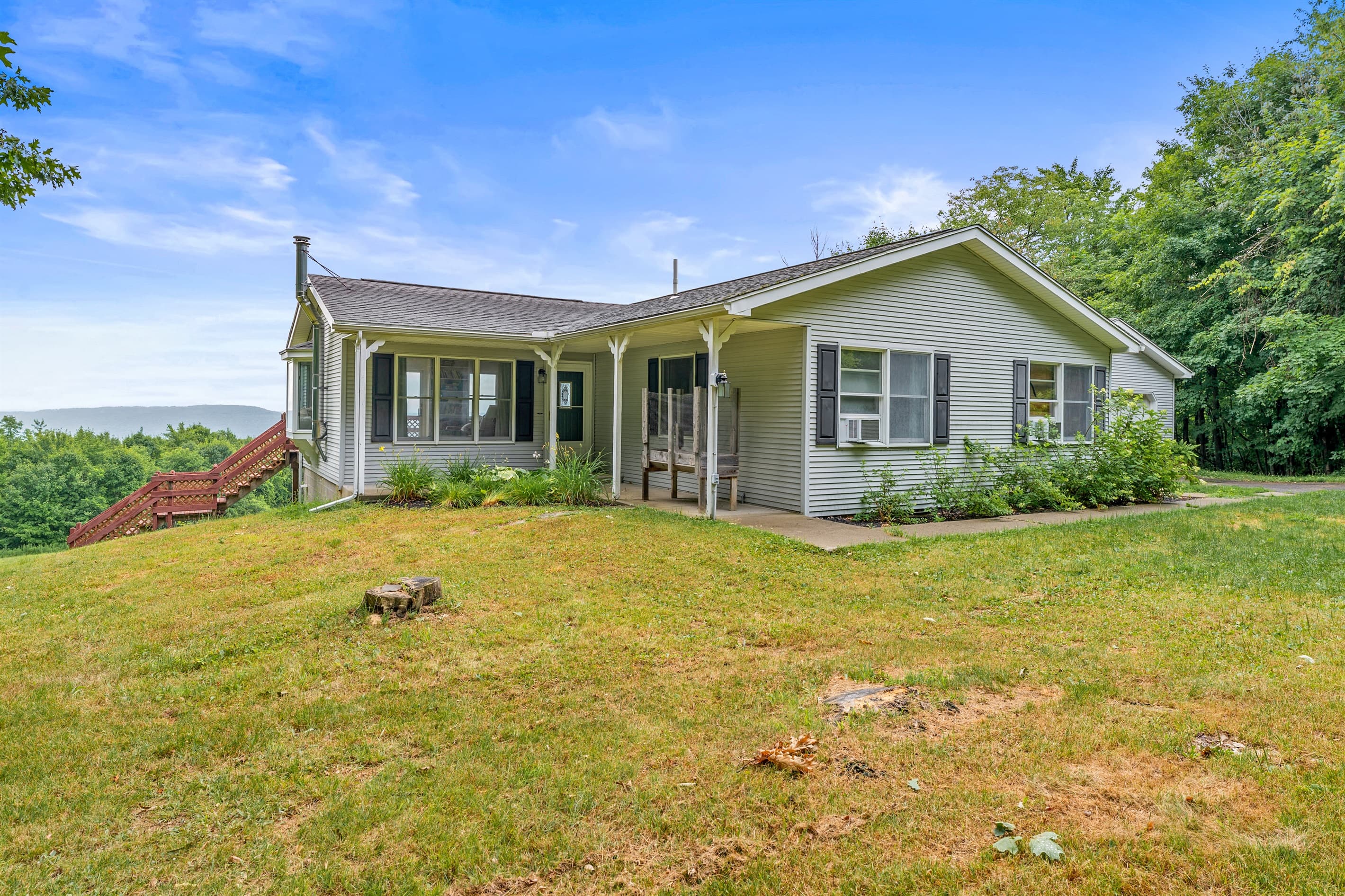 Front exterior bordered by open lawn