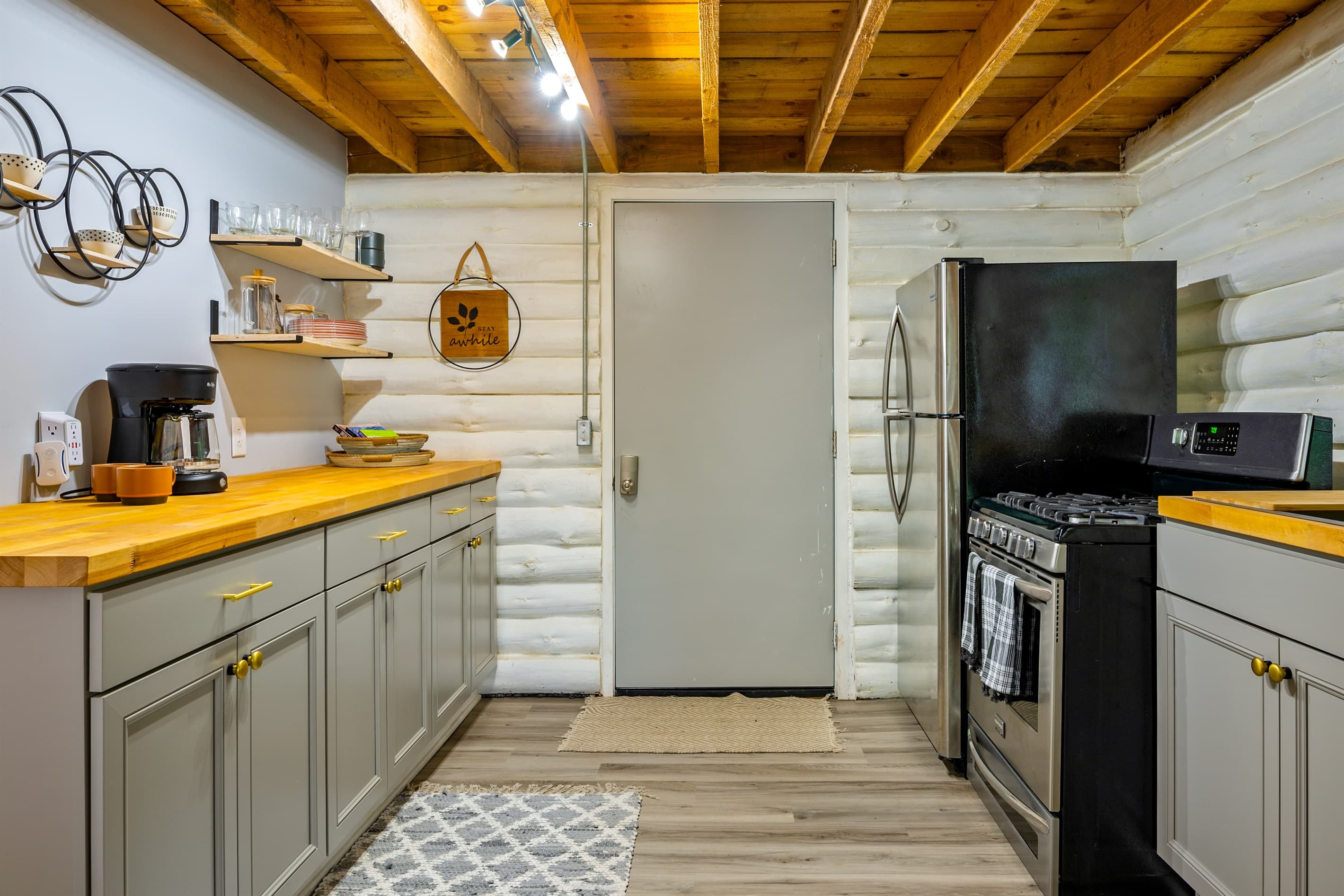 Kitchen with gas range and refrigerator