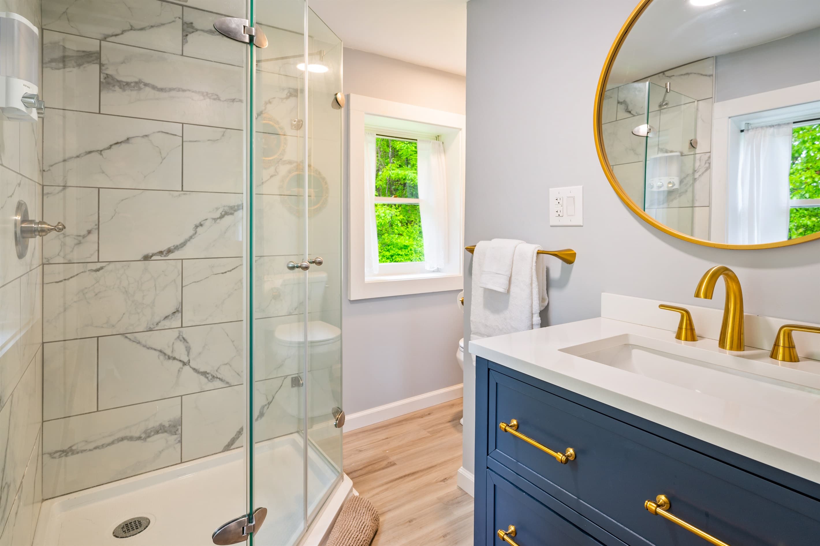 Bathroom with walk-in marble shower