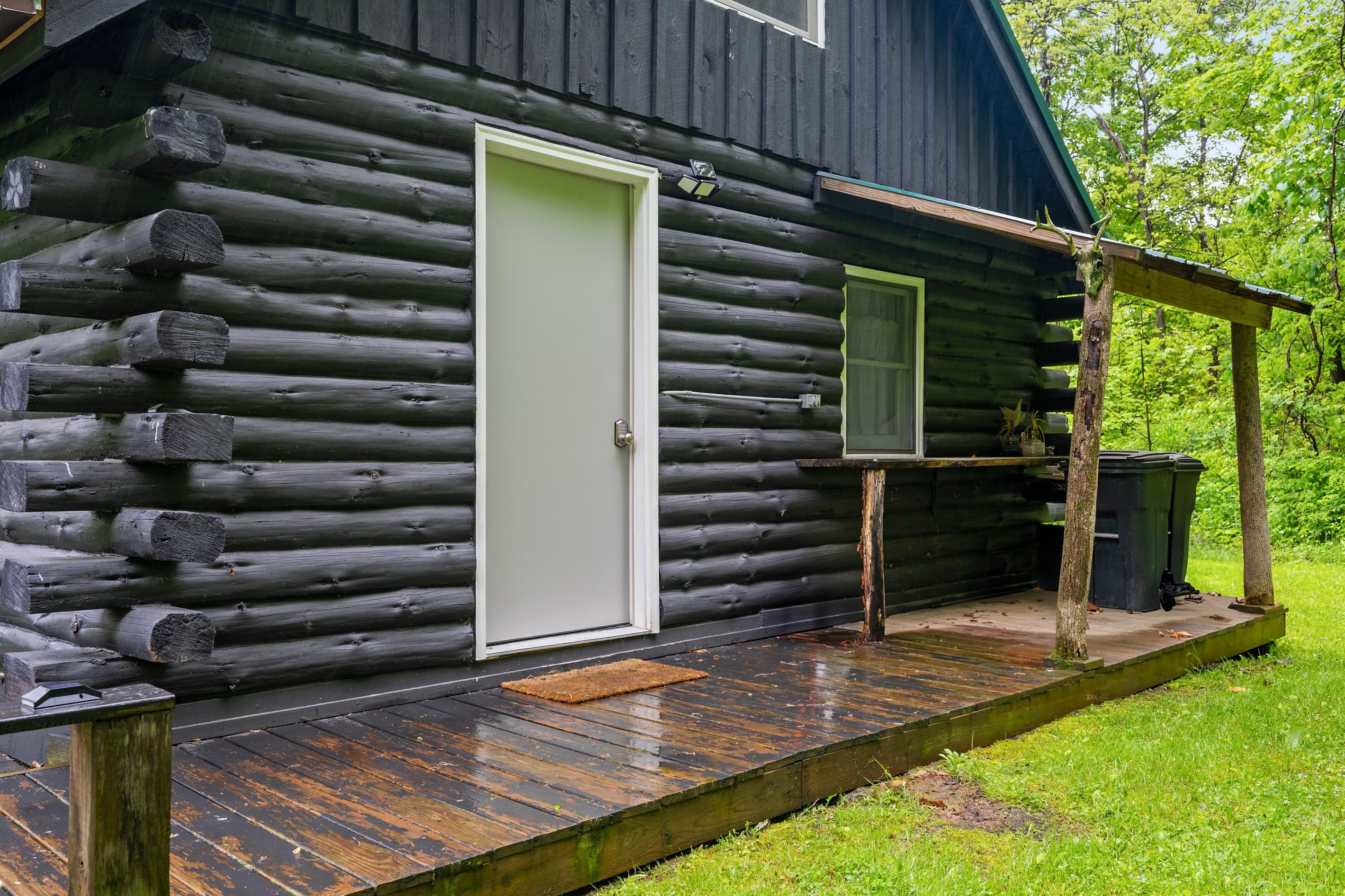 Covered entrance with wooden platform
