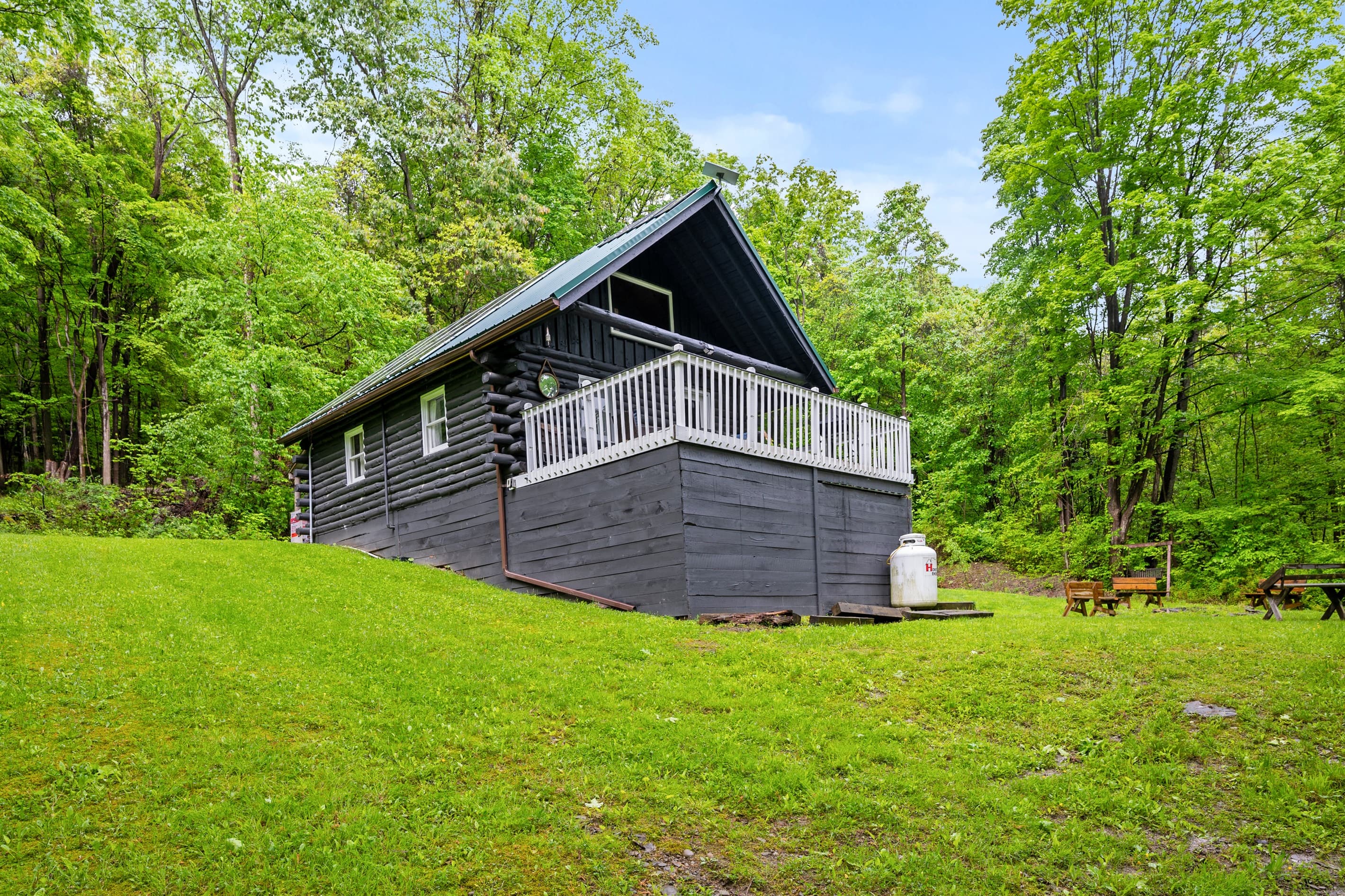 Elevated deck overlooking the wooded yard
