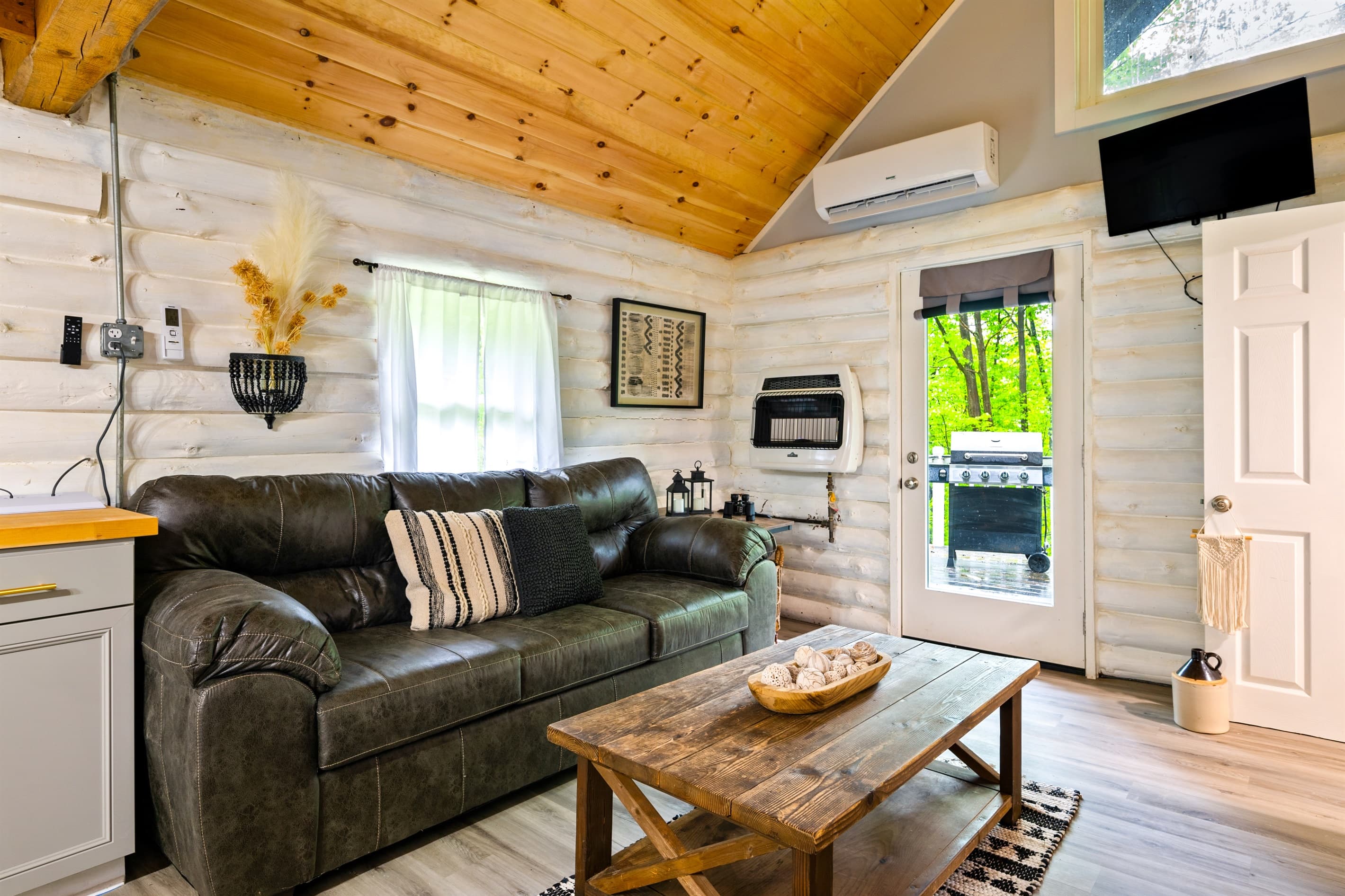 Living room beneath vaulted wood ceilings
