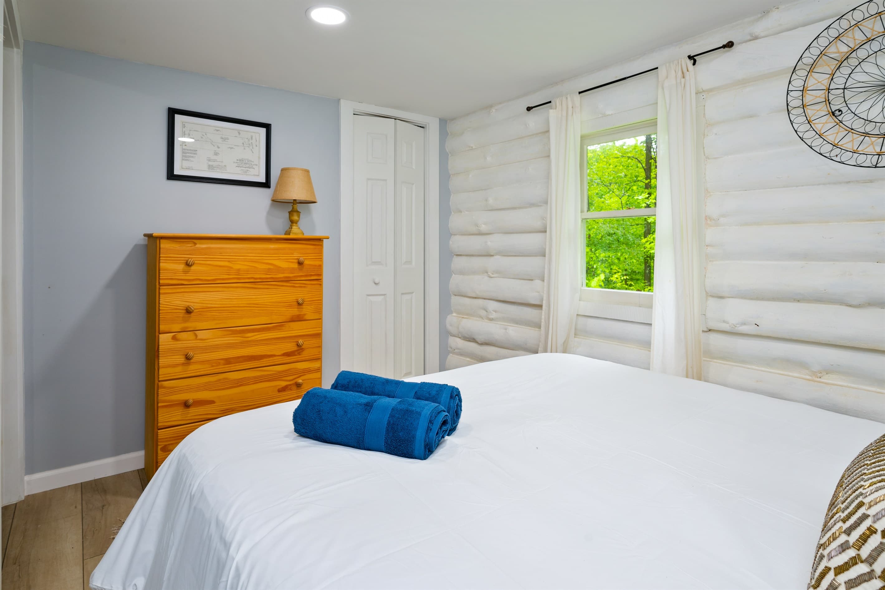 Main-floor bedroom with wooded views
