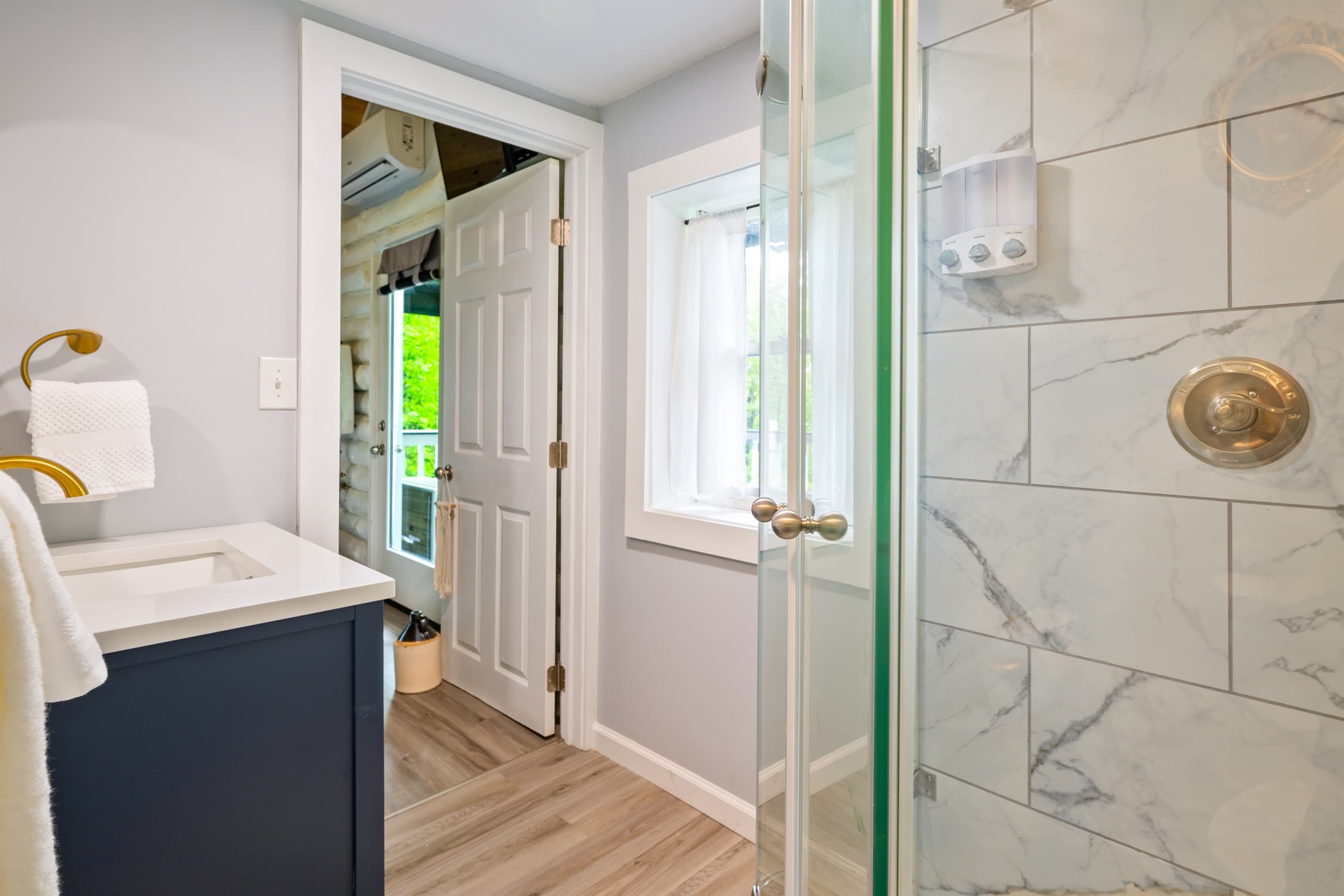 Bathroom with glass-enclosed shower