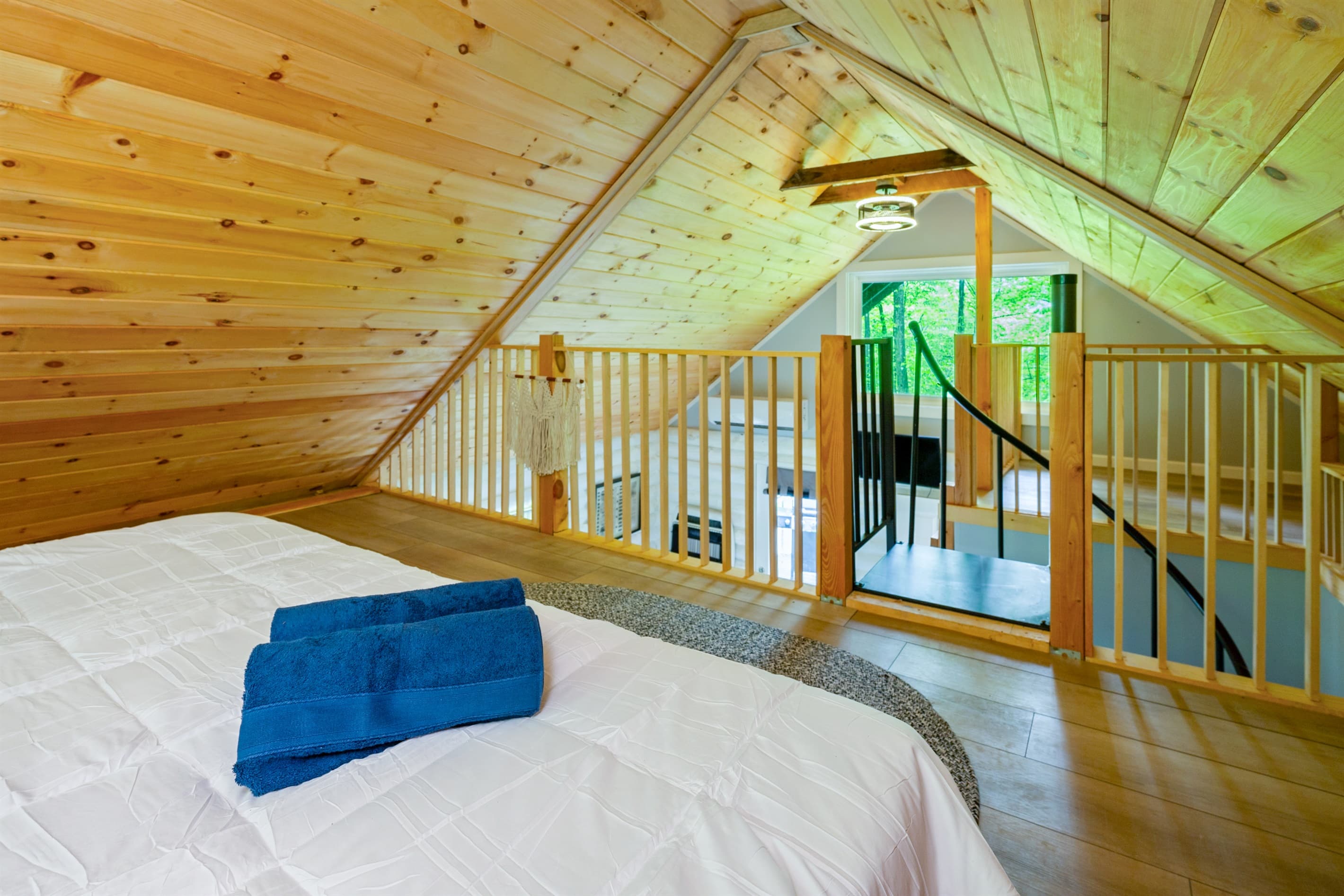 Loft bedroom beside the spiral staircase