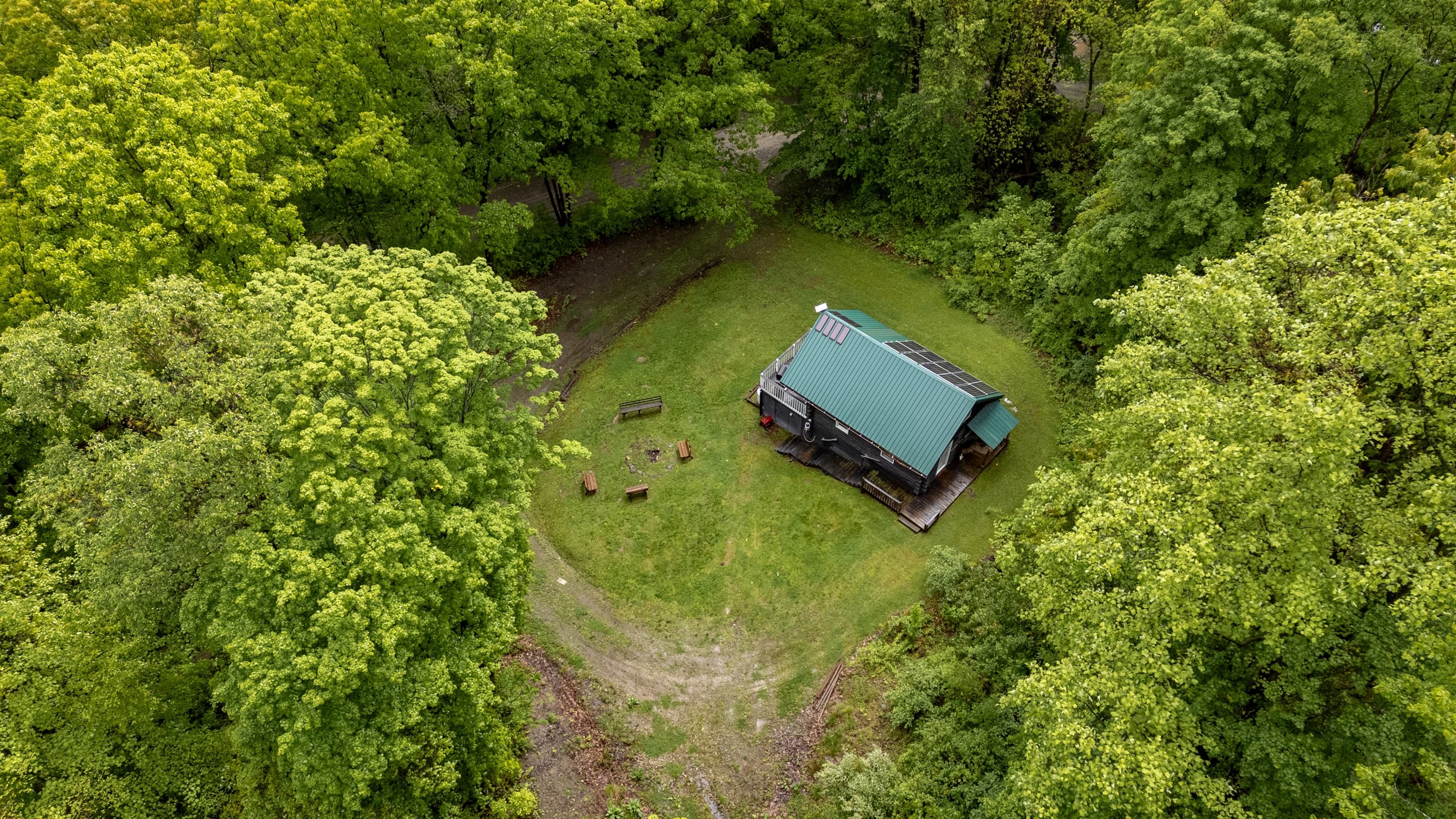 Aerial view of cabin and fire pit area