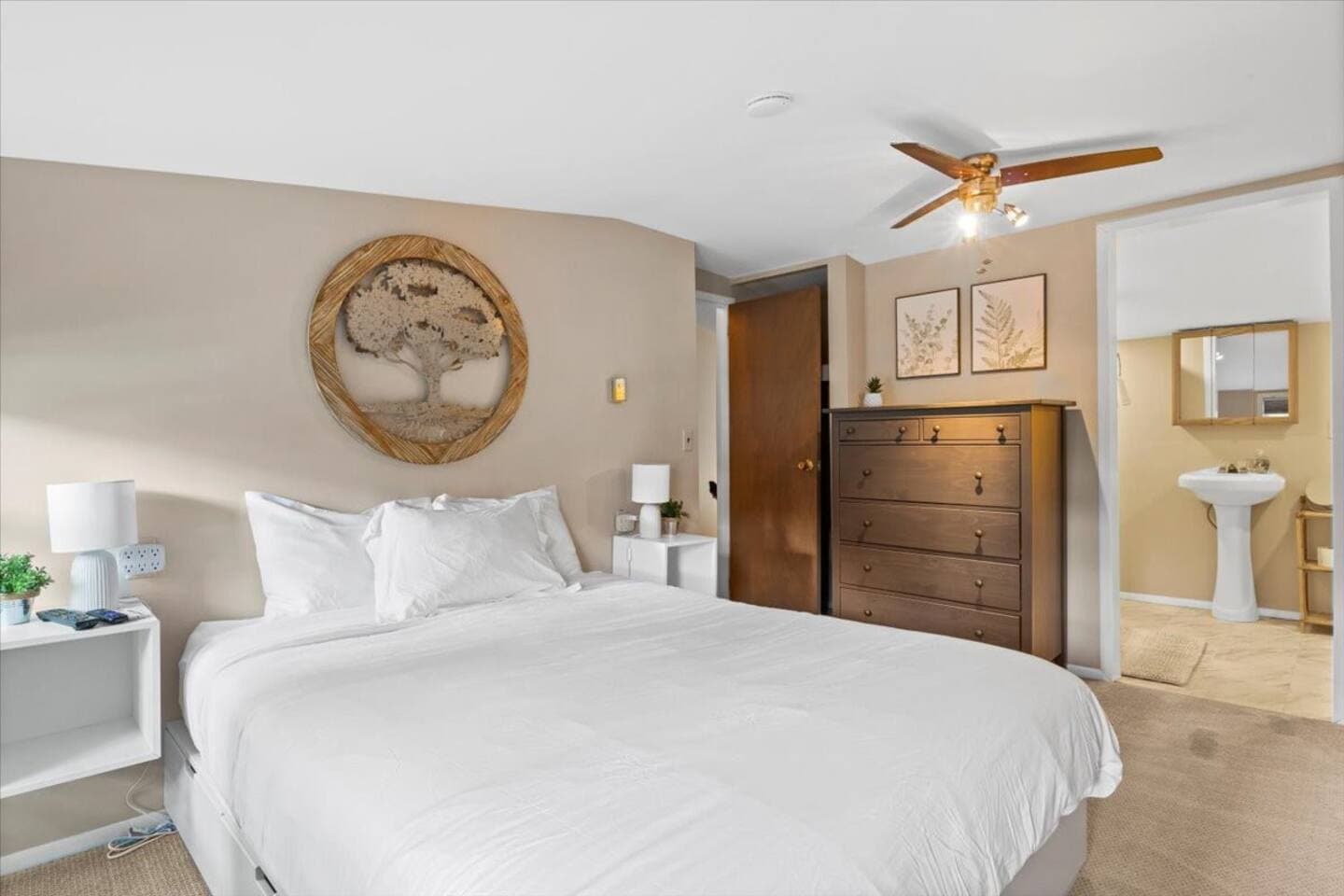 Bedroom with wooden dresser and ceiling fan