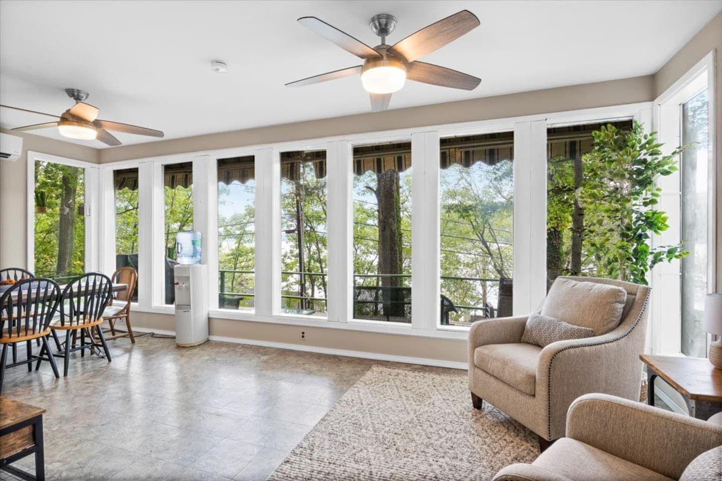 Sunroom with seating and ceiling fans