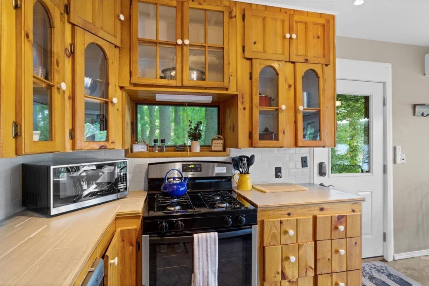 Kitchen range surrounded by wood cabinetry