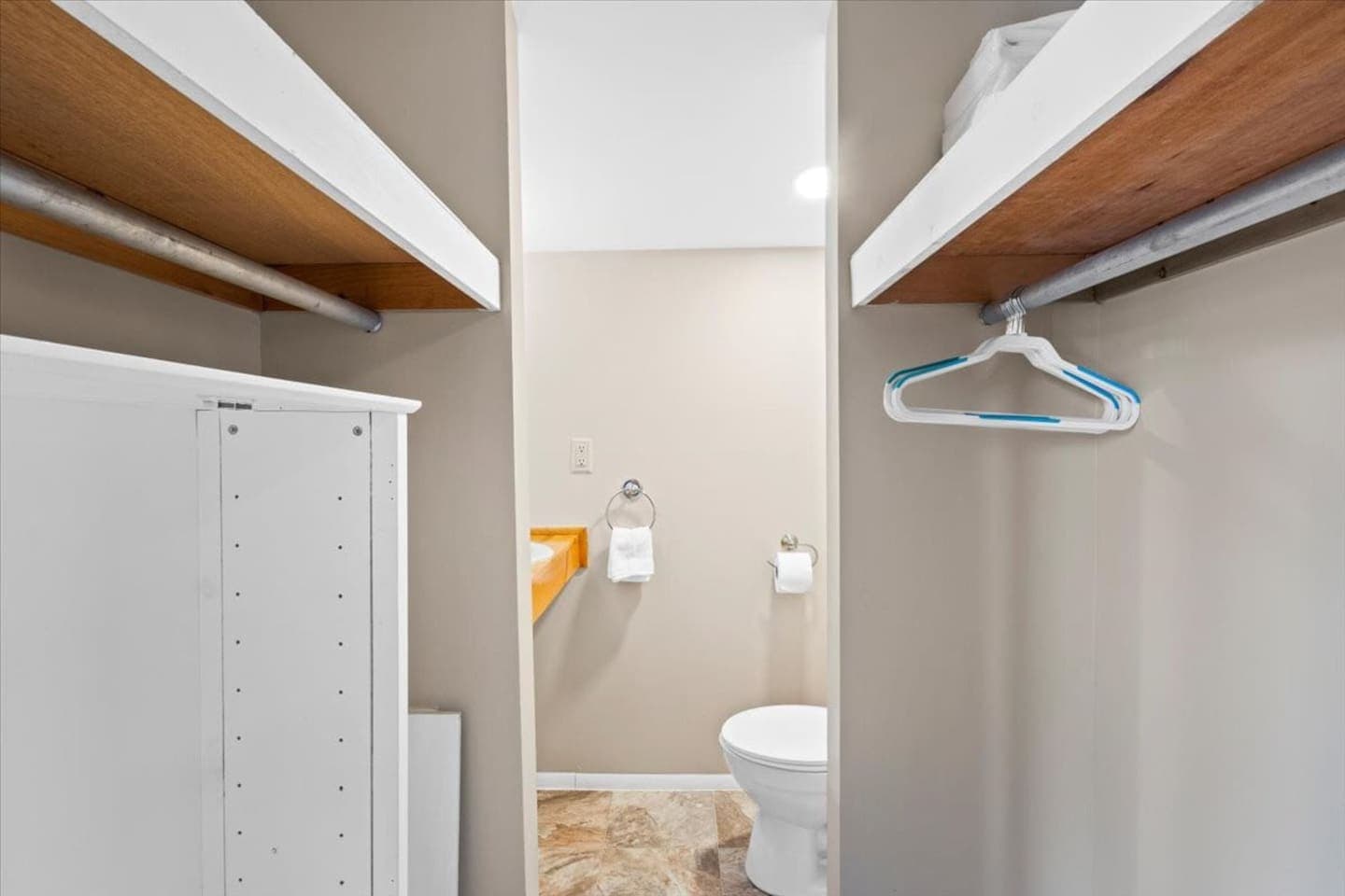 Open closet with shelf and hanging rod