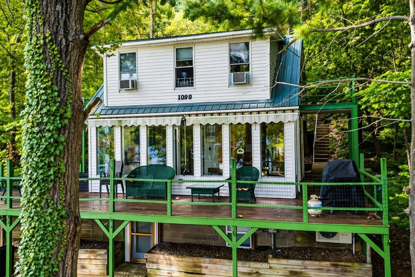 Two-story exterior with green deck