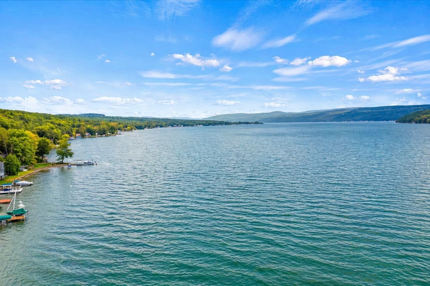 Wide lake view beneath blue sky
