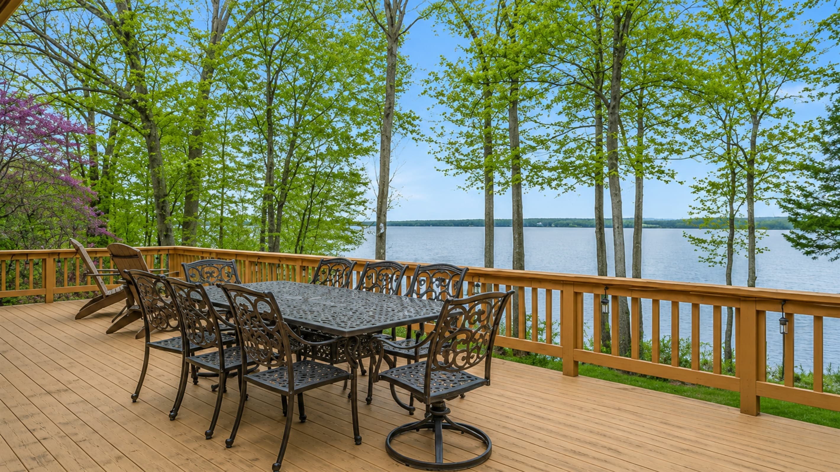 Deck dining area with panoramic lake views