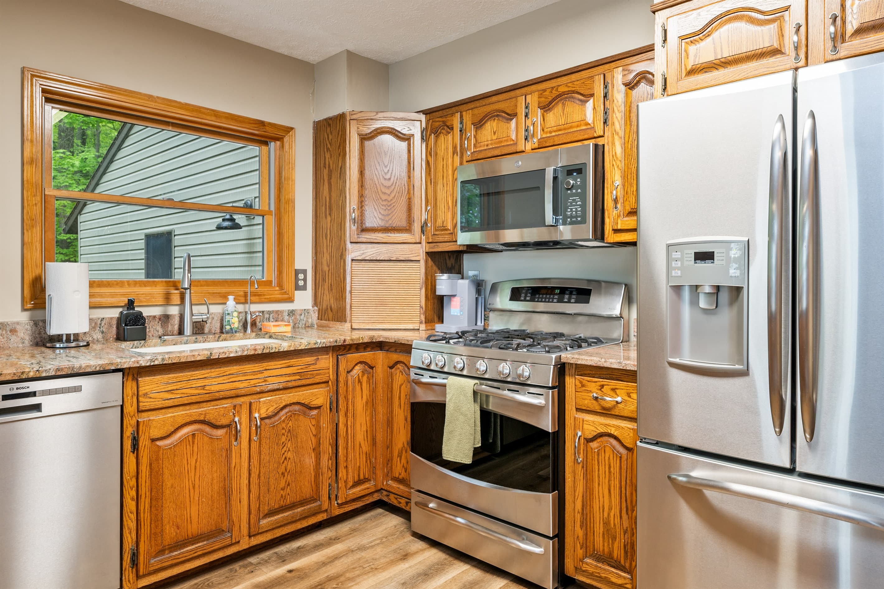 Wood kitchen with stainless steel appliances