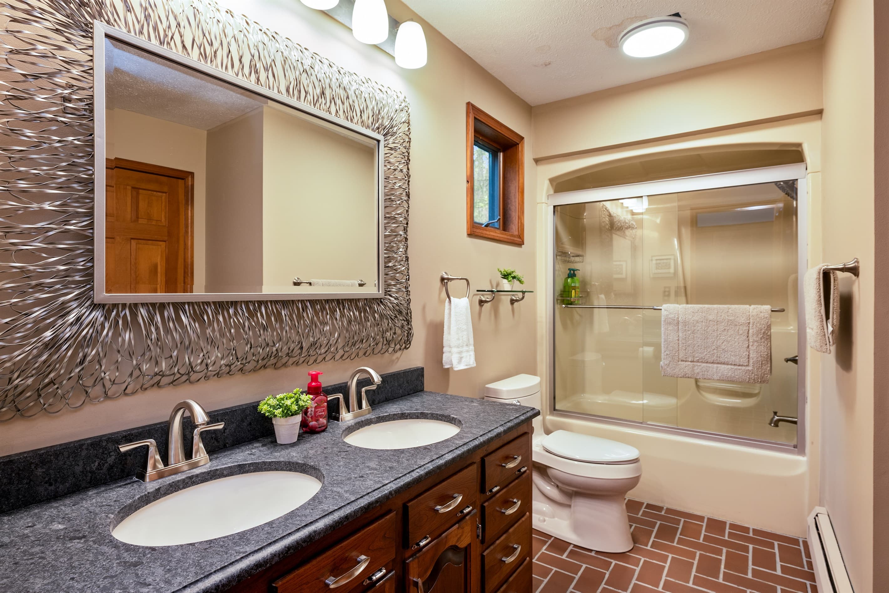 Double vanity bathroom with tub and shower