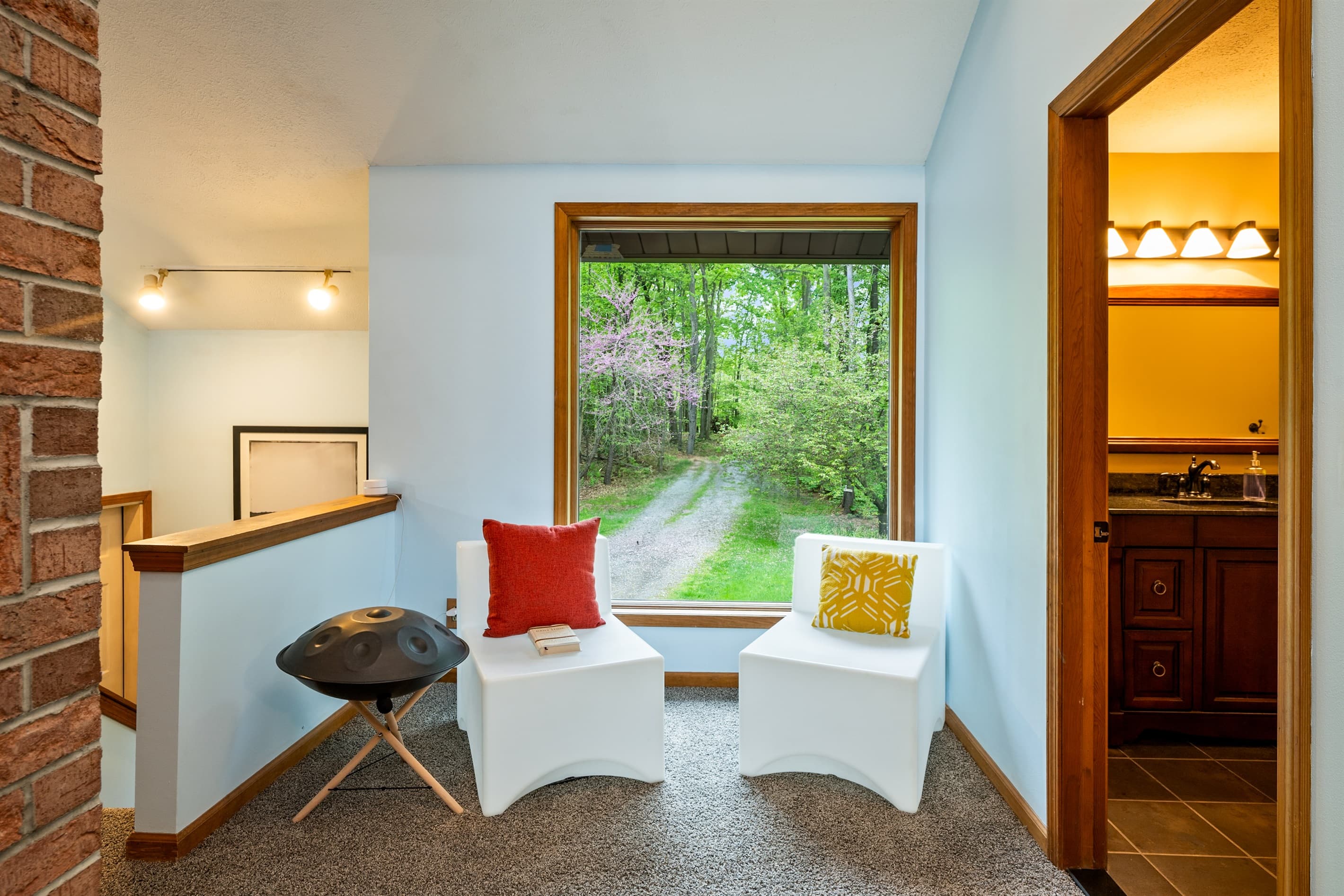 Window seating area with wooded views