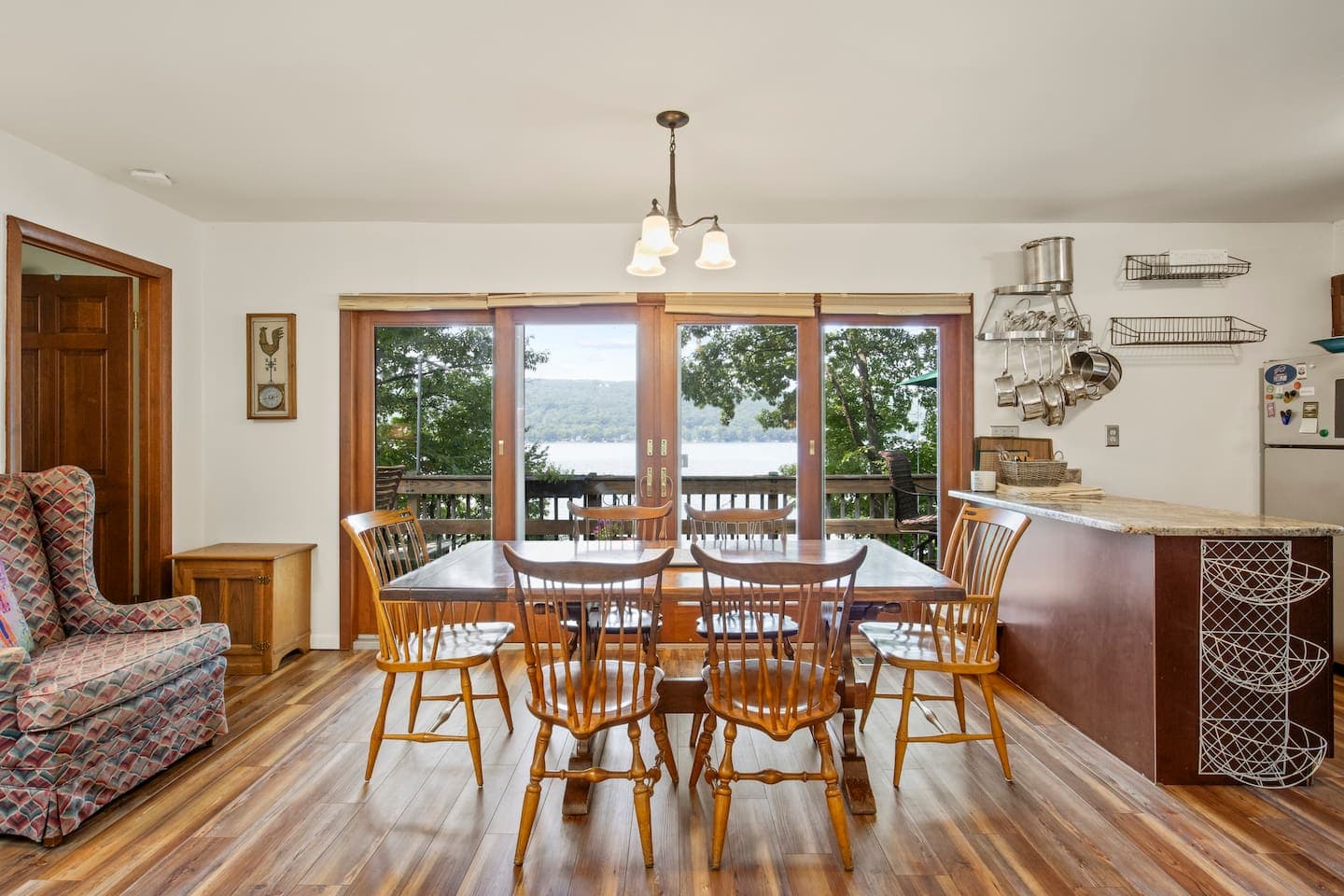 Dining area surrounded by lake-facing windows