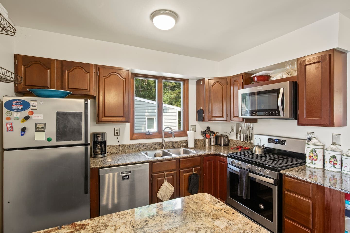 Kitchen with wood cabinetry and stainless appliances