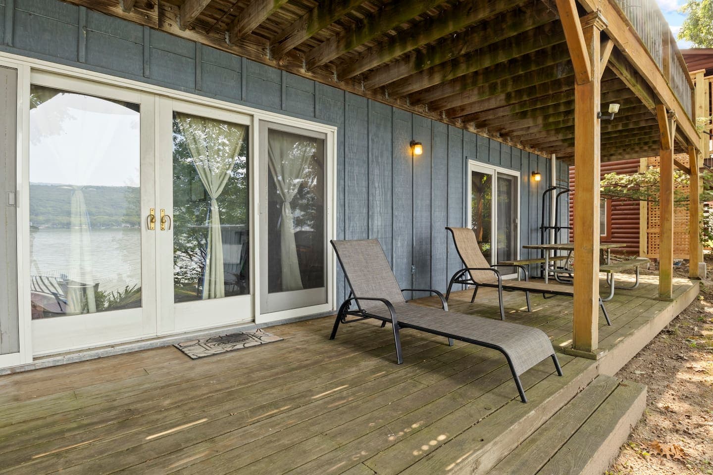 Shaded deck with outdoor dining furniture