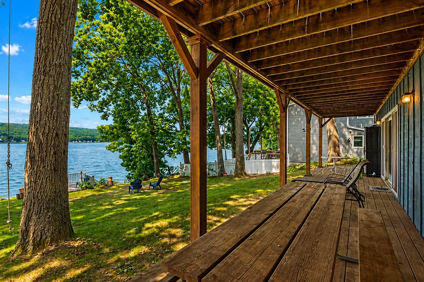 Covered deck beside the wooded yard