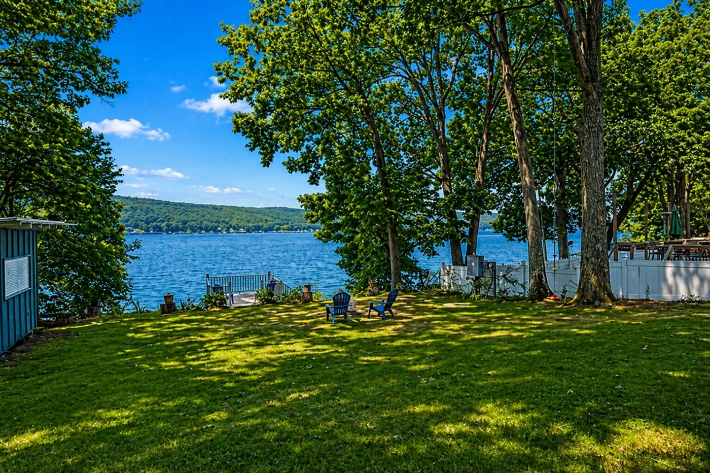 Grassy yard leading toward the water