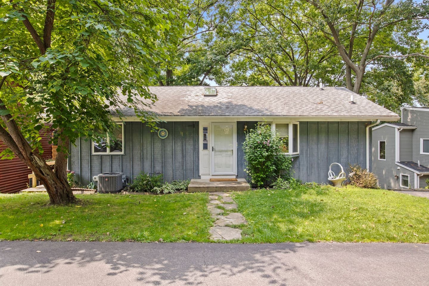 Single-story cottage with covered entry